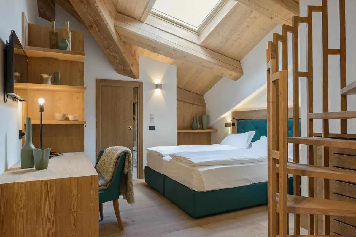 Bed in Royal Hotel Cortina