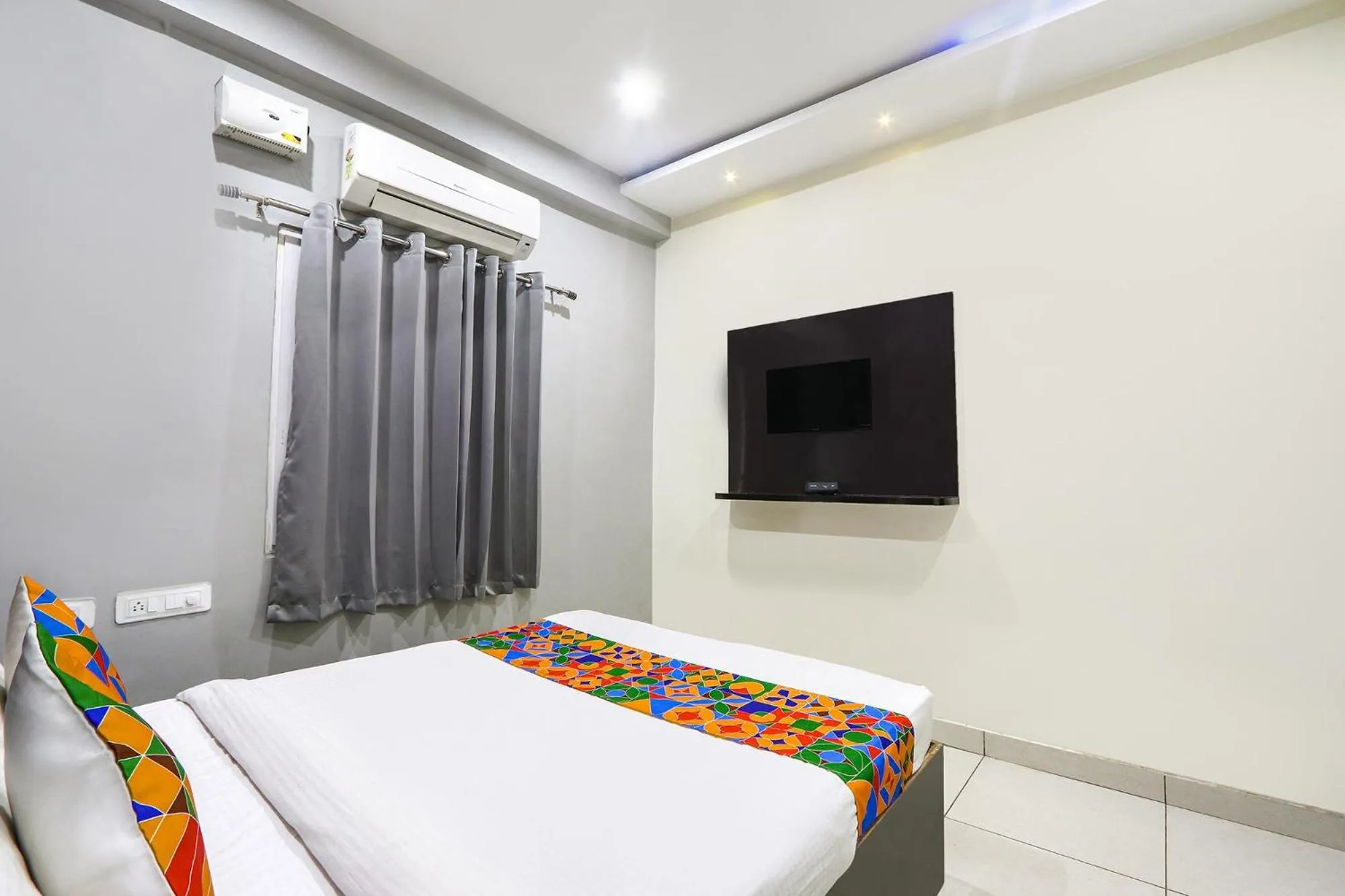 Bed in FabHotel Galaxy Suites