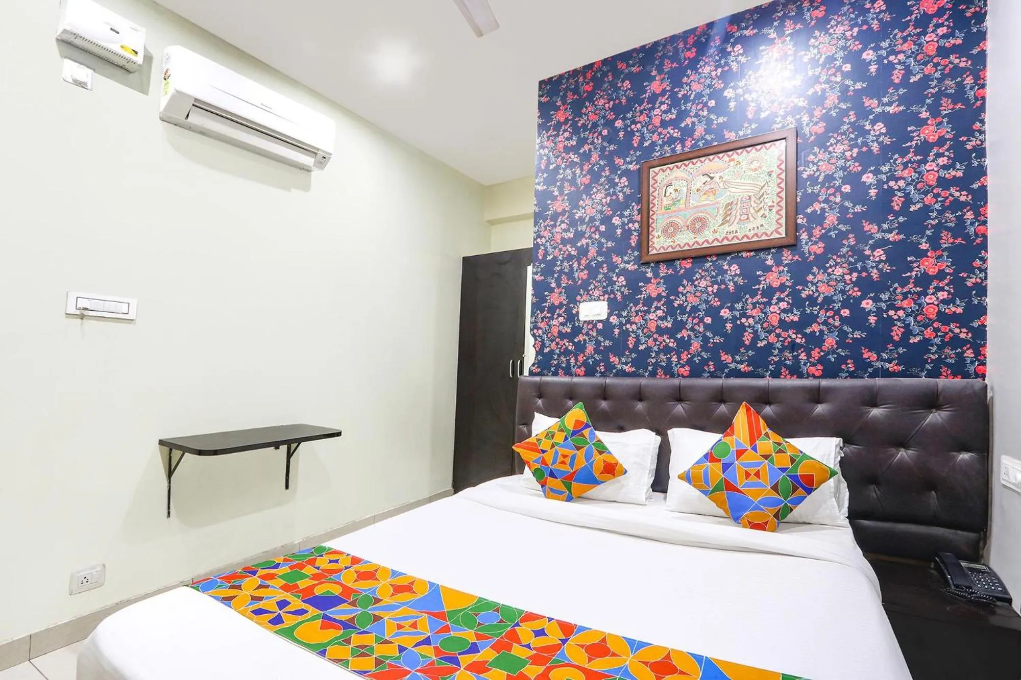 Bed in FabHotel Galaxy Suites