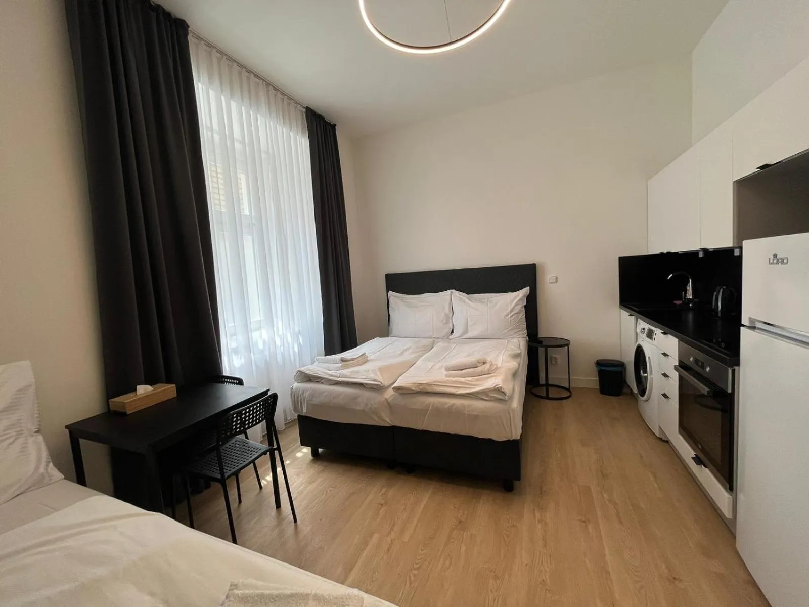 Bed in Figaro Suites