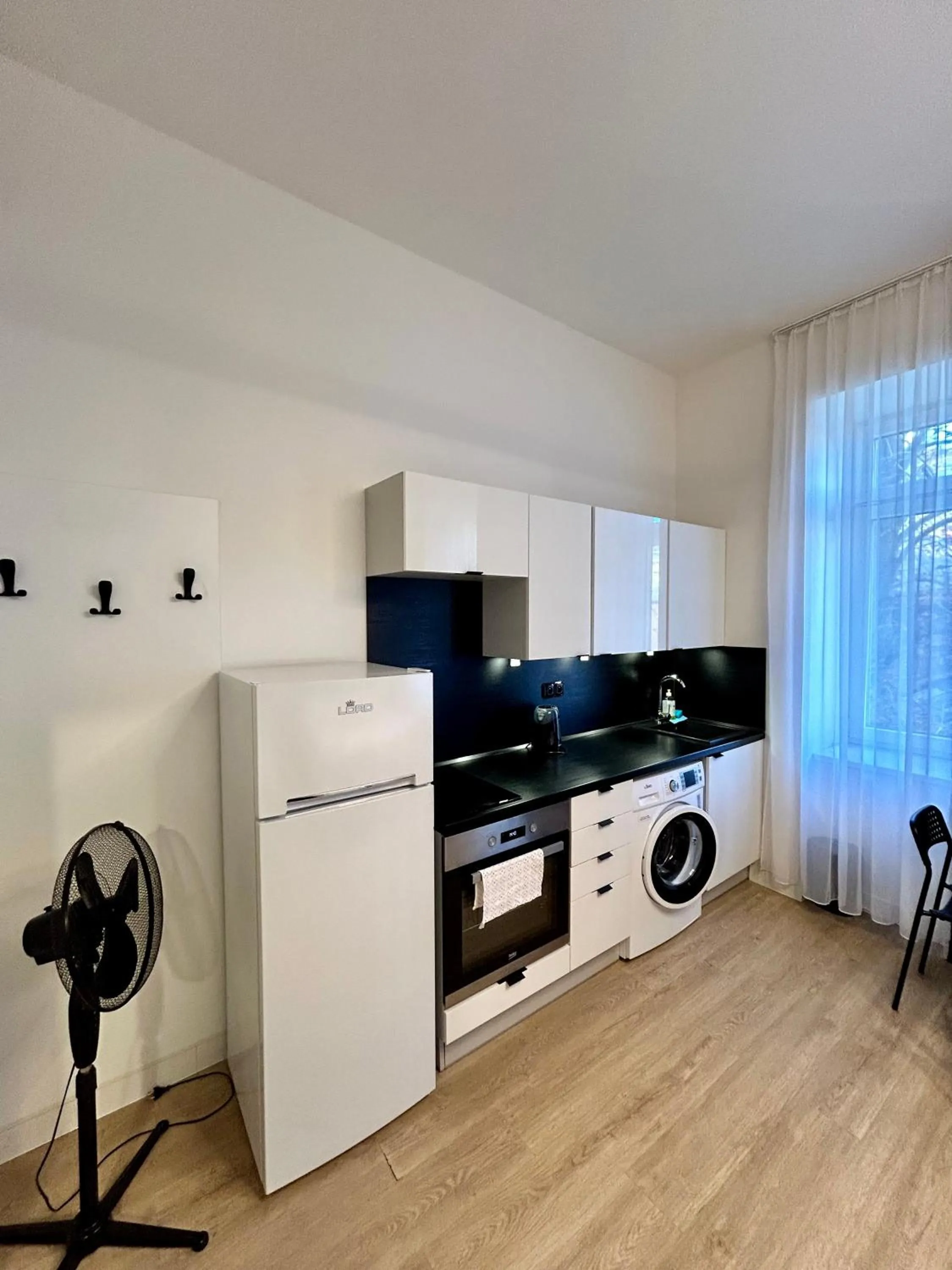 Kitchen or kitchenette in Figaro Suites