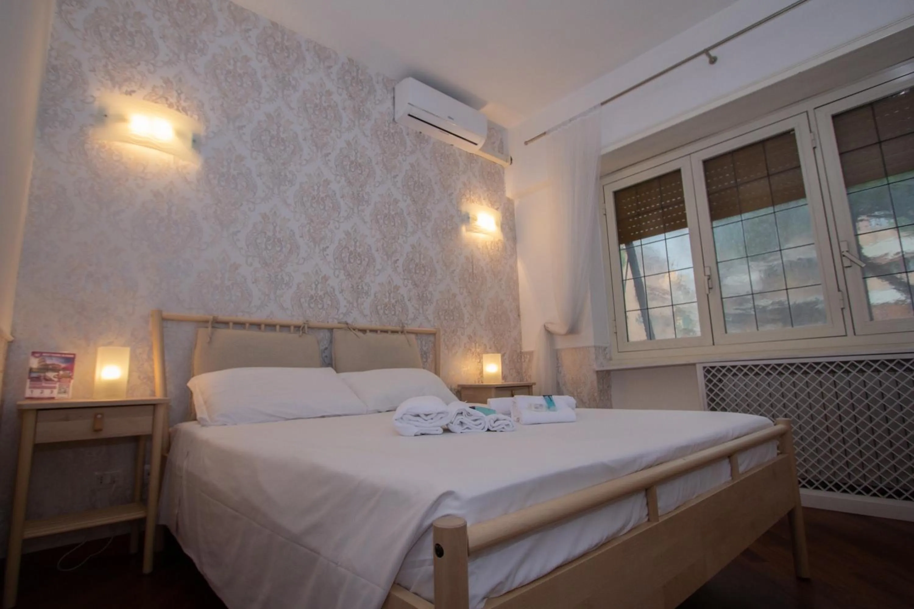 Bed in Aurelio Deluxe Rooms