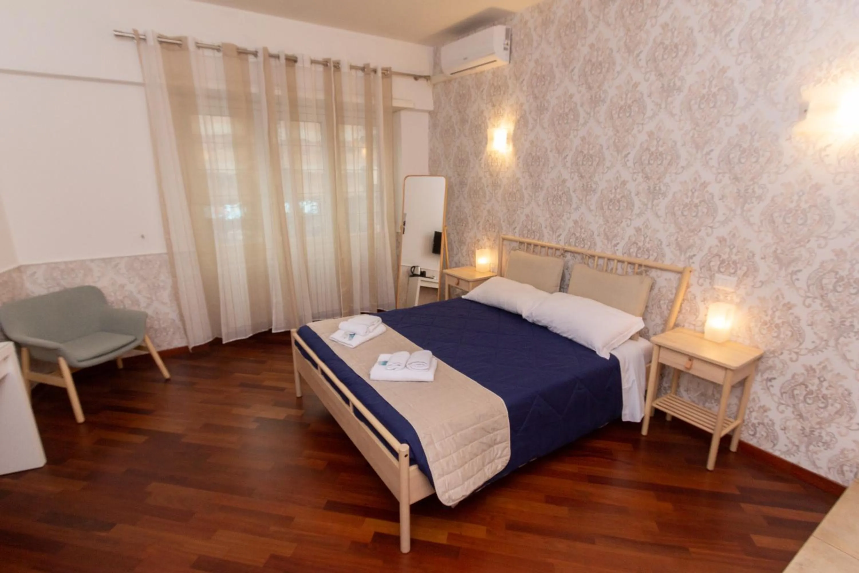 Bed in Aurelio Deluxe Rooms