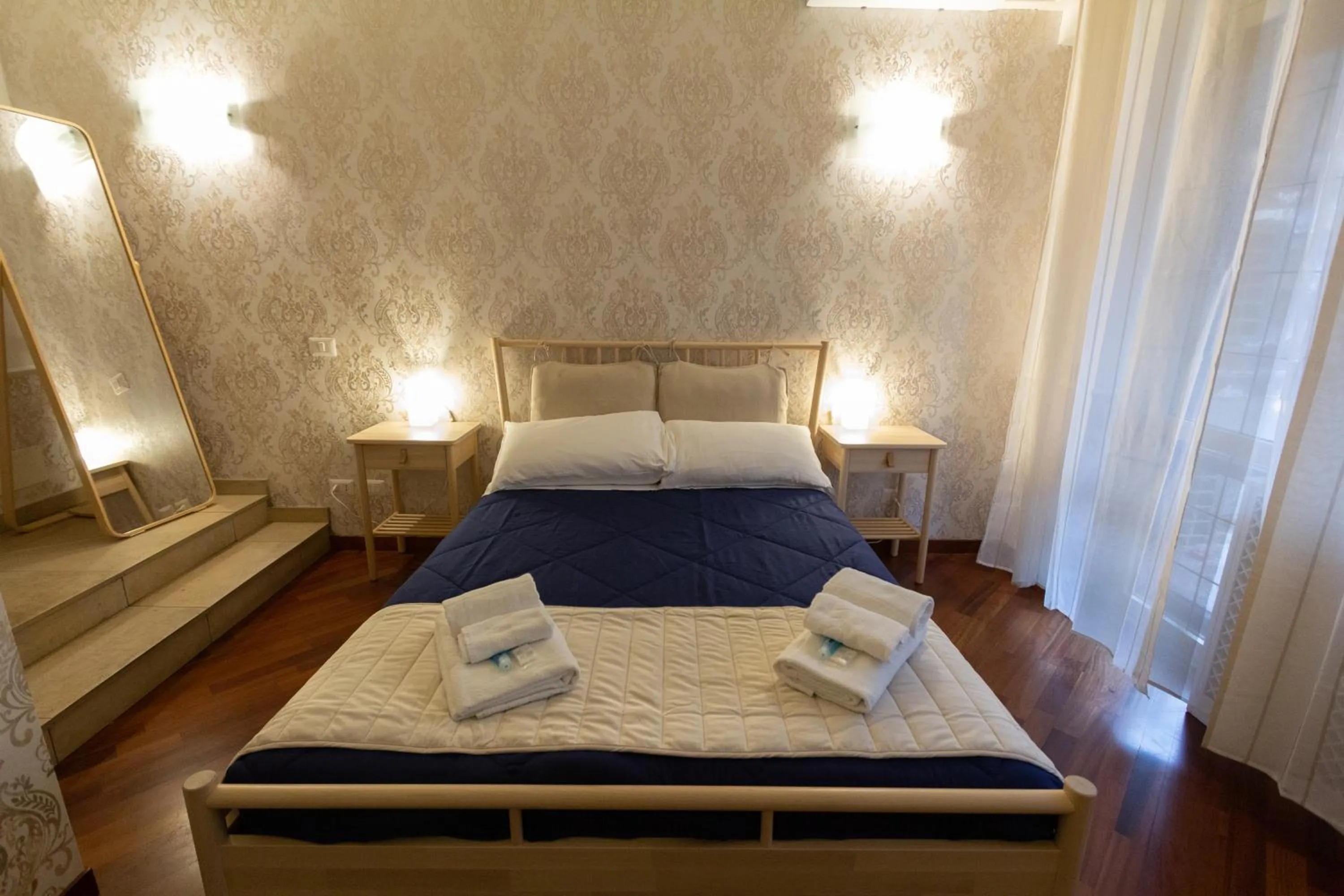 Bed in Aurelio Deluxe Rooms