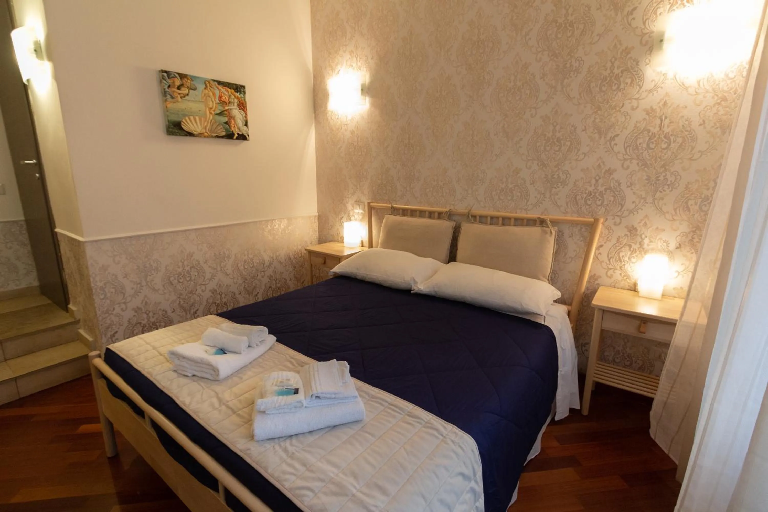 Bed in Aurelio Deluxe Rooms