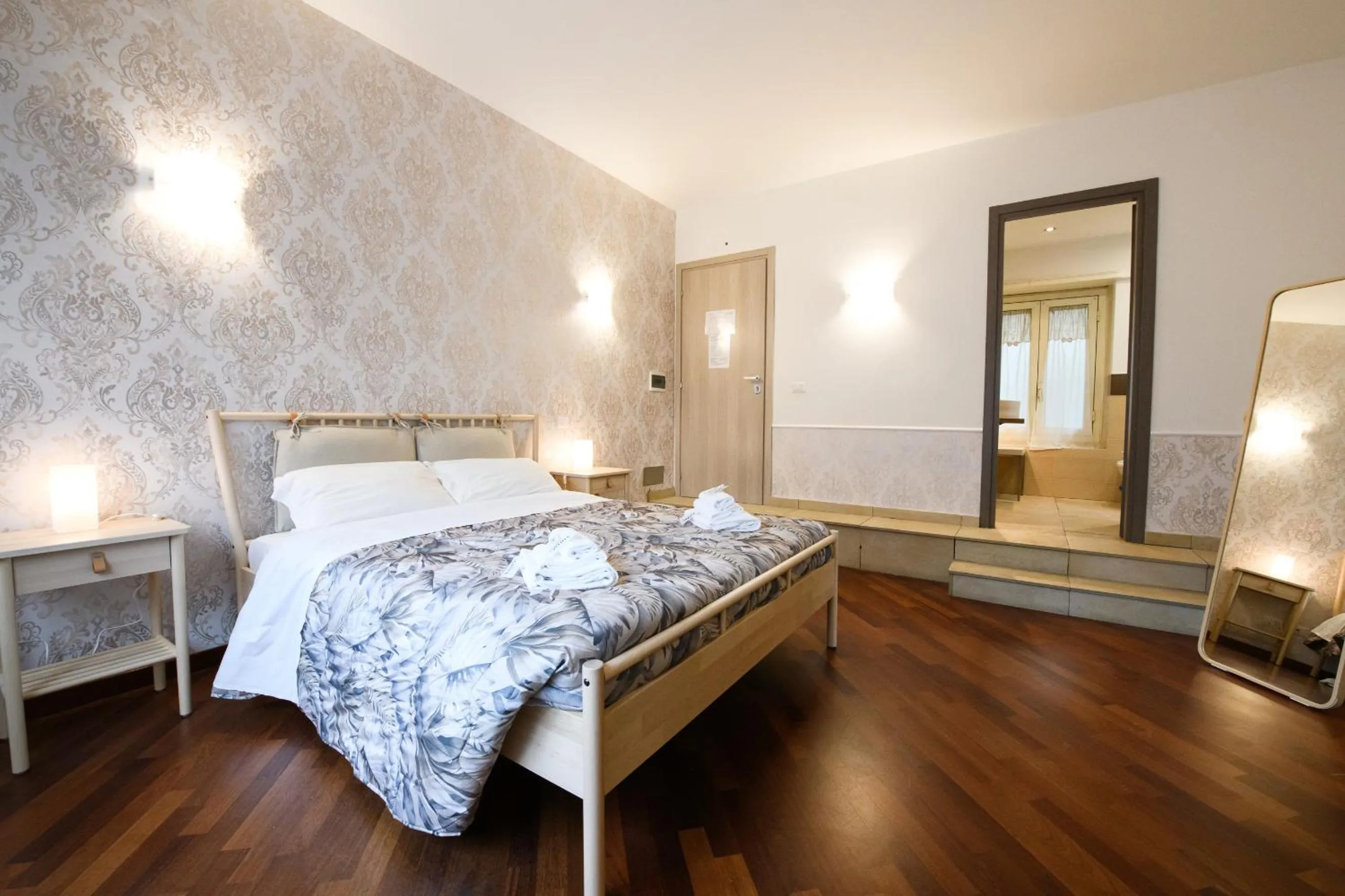 Bed in Aurelio Deluxe Rooms