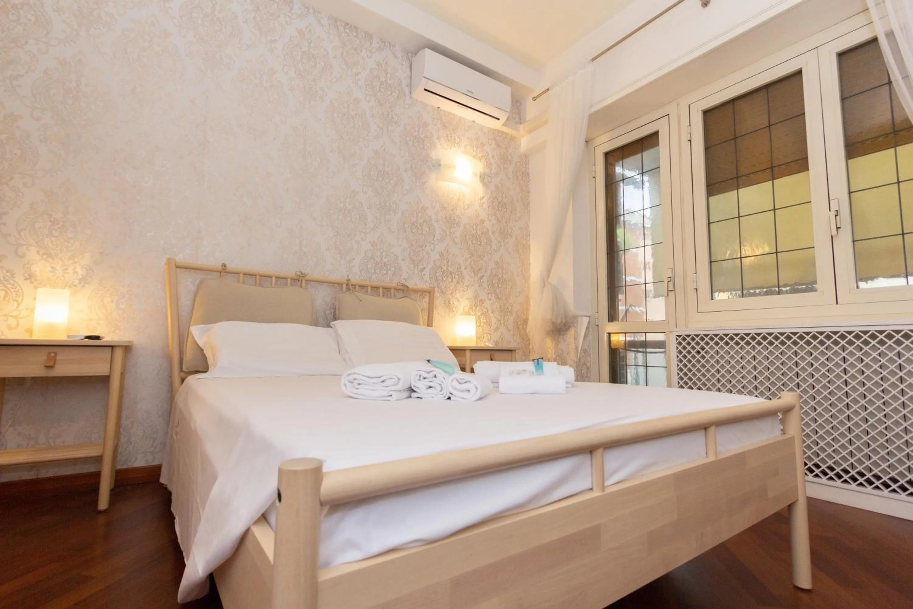 Bed in Aurelio Deluxe Rooms