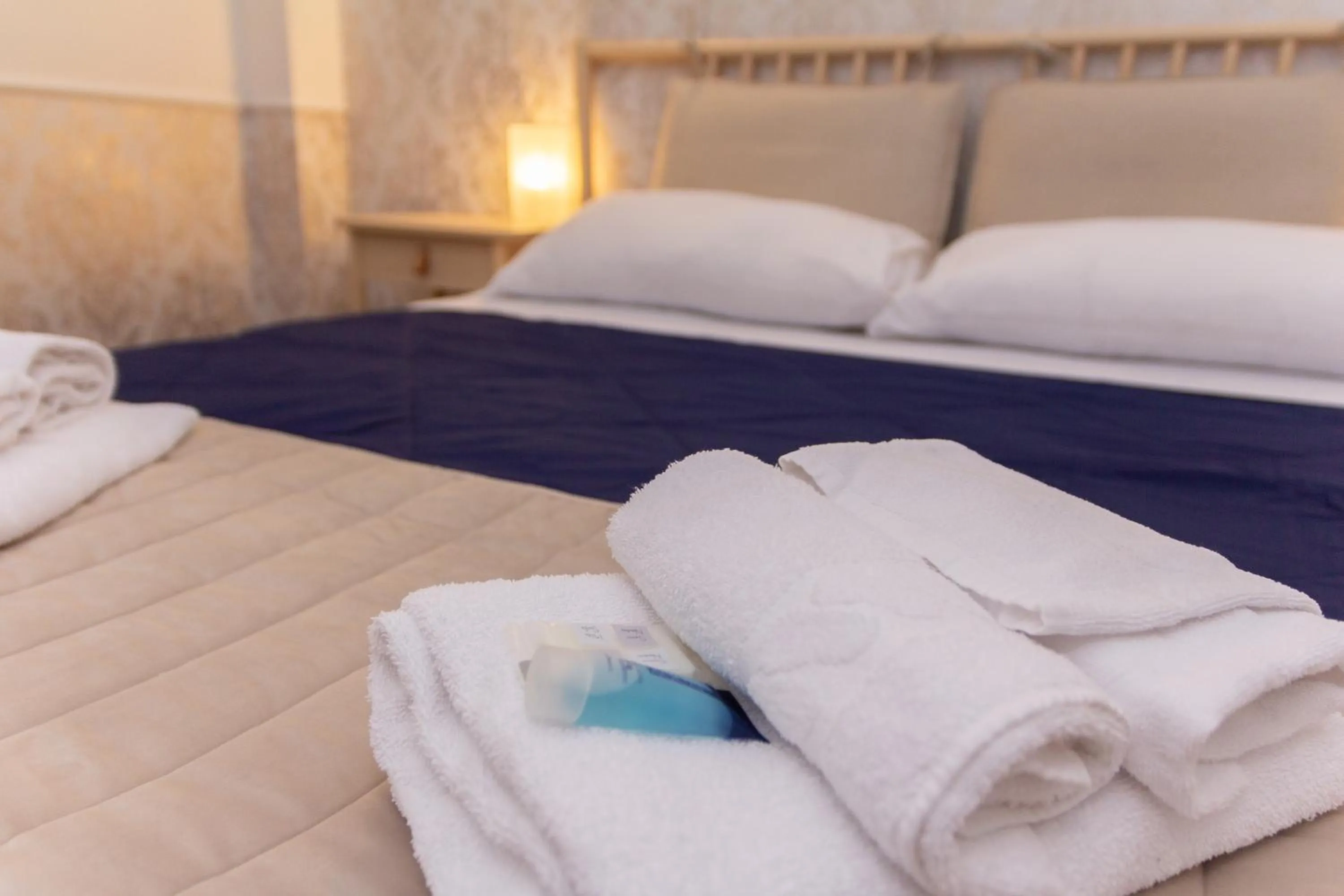 Decorative detail, Bed in Aurelio Deluxe Rooms