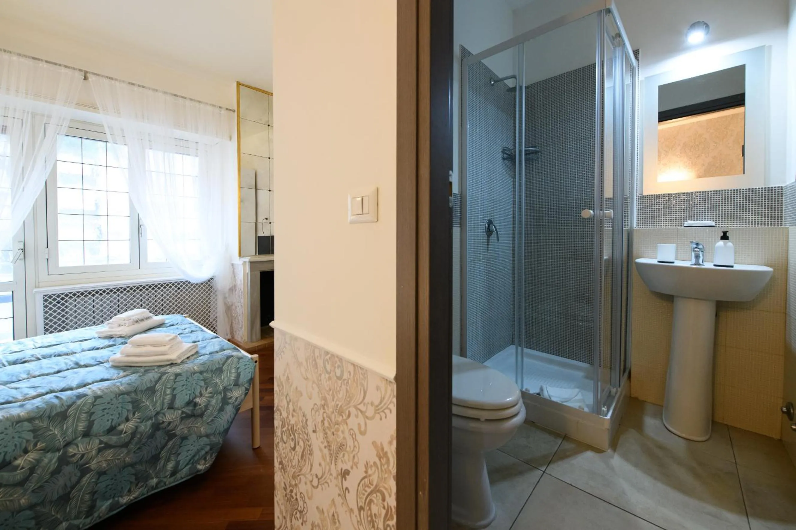 Bed in Aurelio Deluxe Rooms