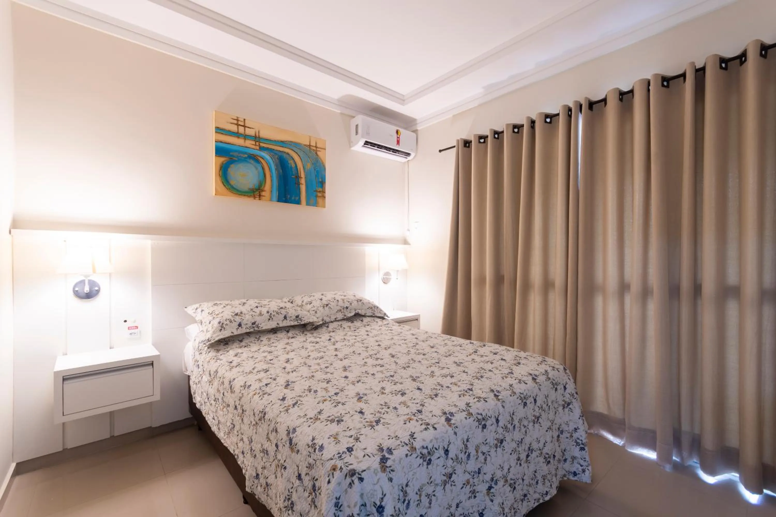 Bed in Bombinhas Tourist Apart