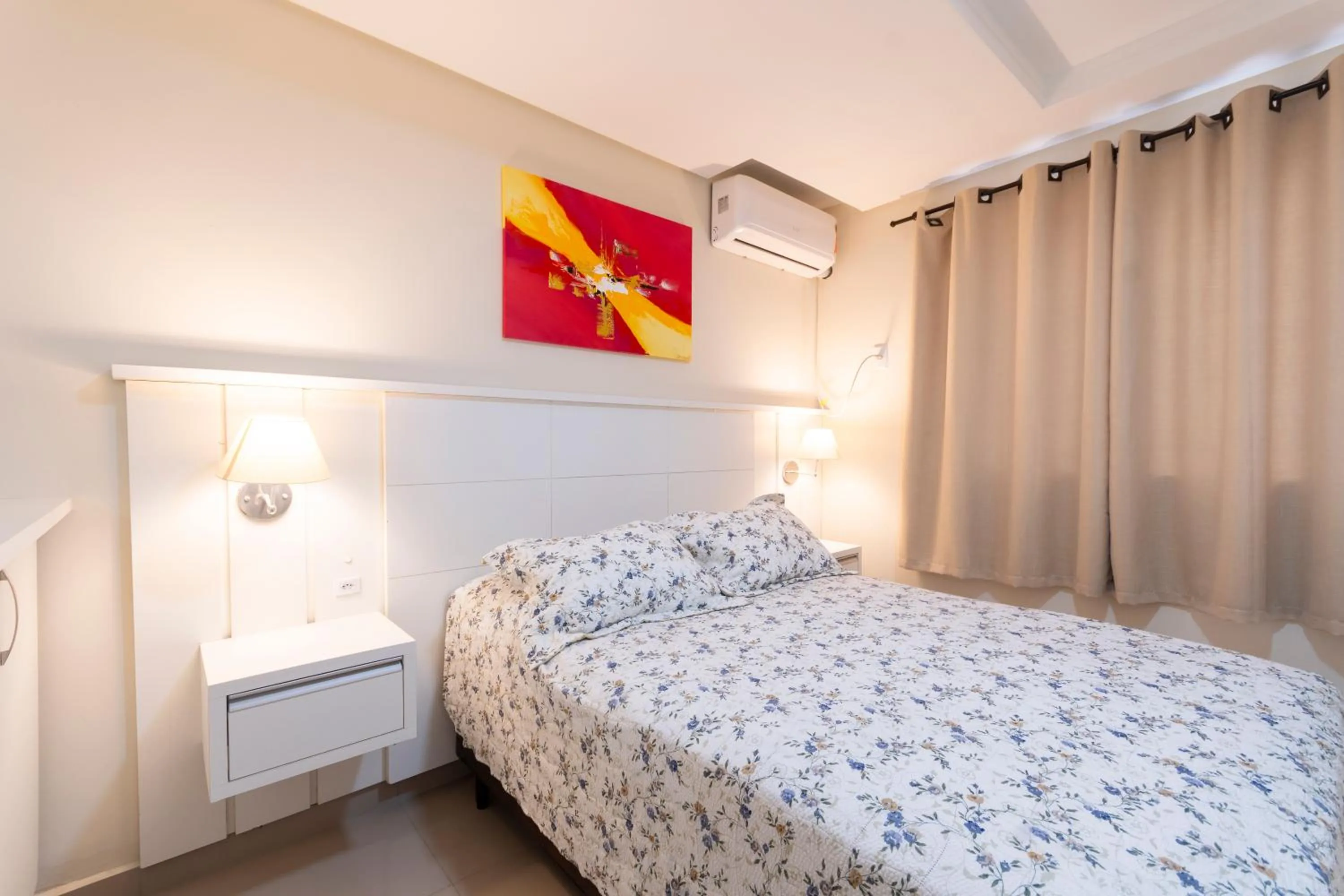 Bed in Bombinhas Tourist Apart