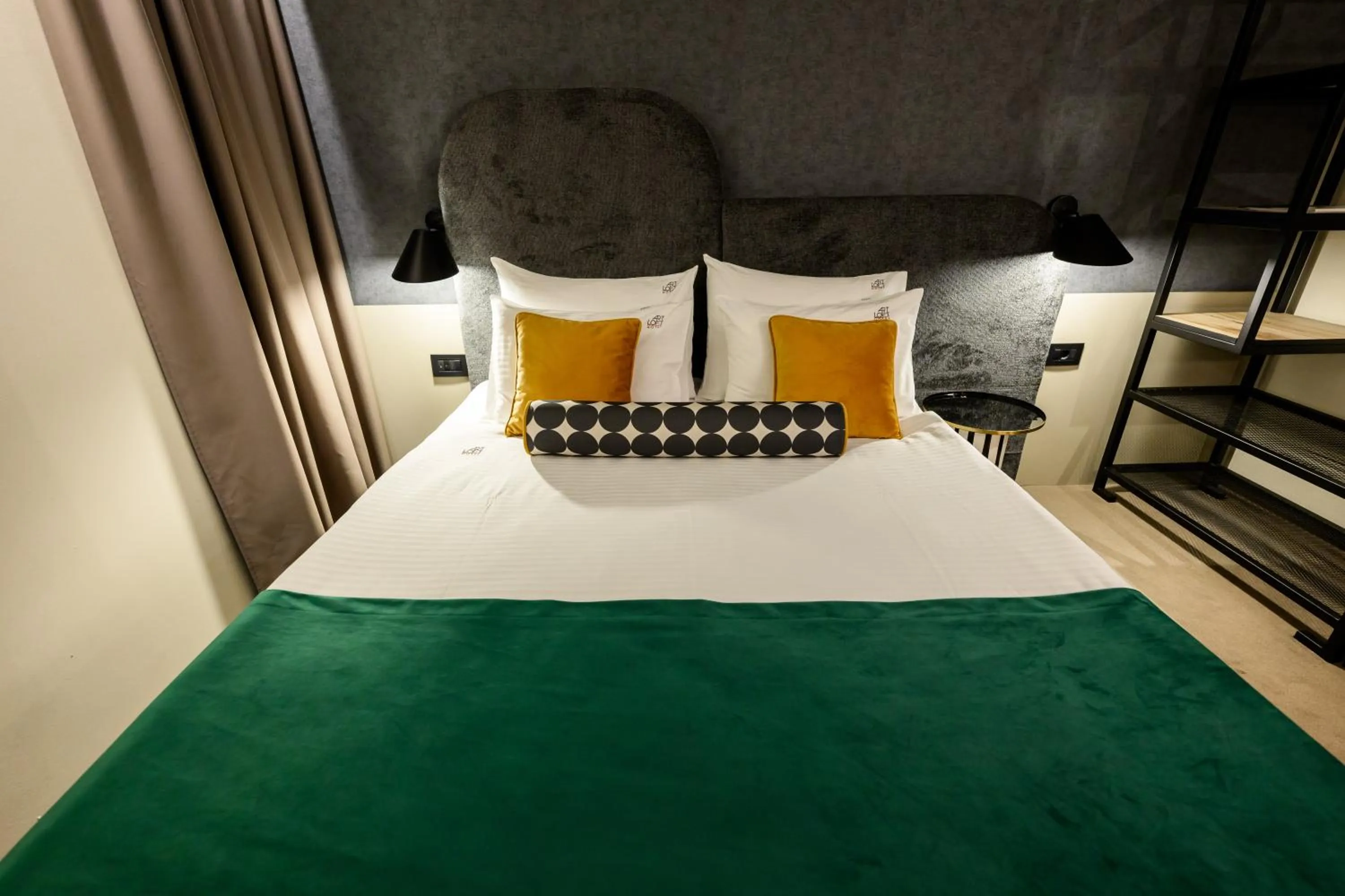 Bed in ArtLoft Garni Hotel