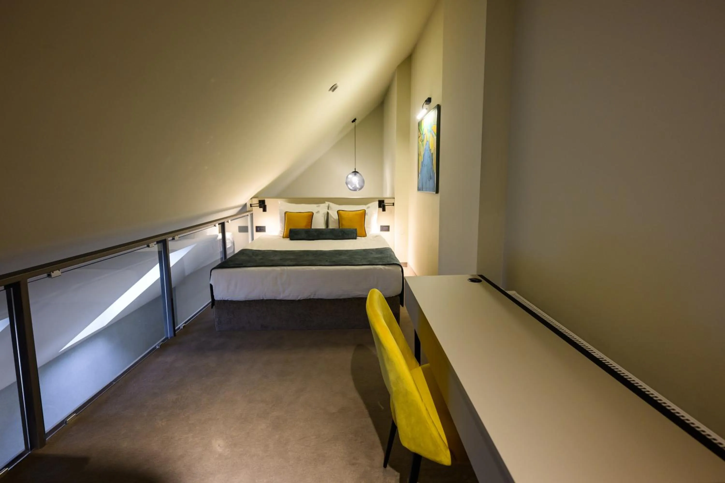 Bed in ArtLoft Garni Hotel