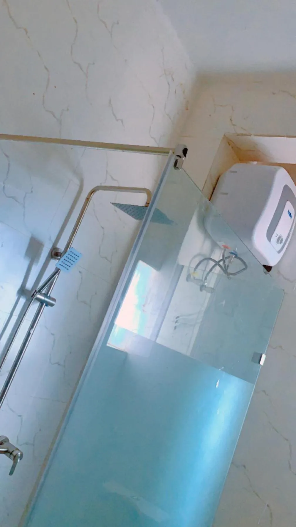 Shower in ROSES REGENCY HOTEL AND SUITES