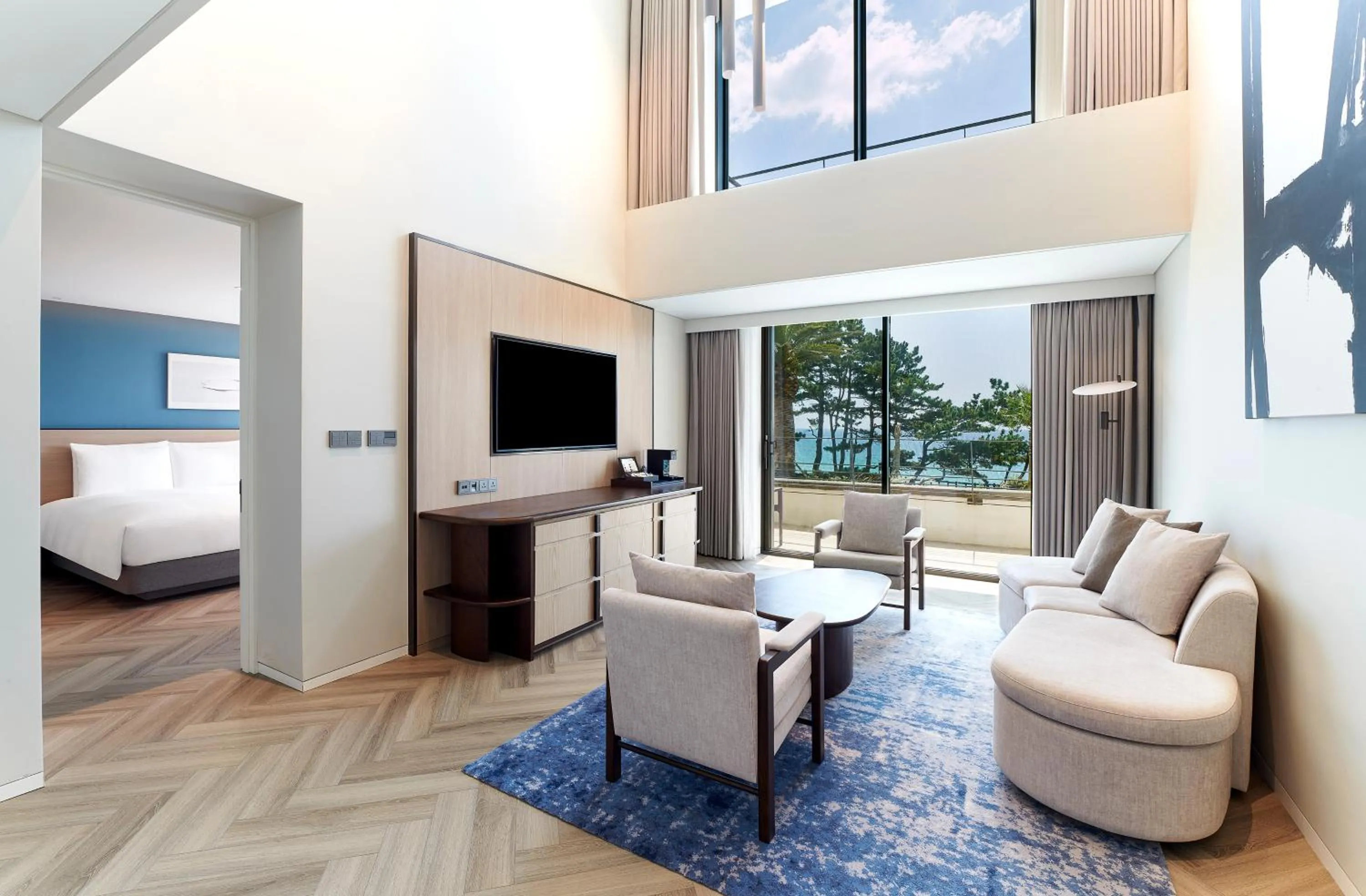 Living room, Bed in Parnas Hotel Jeju