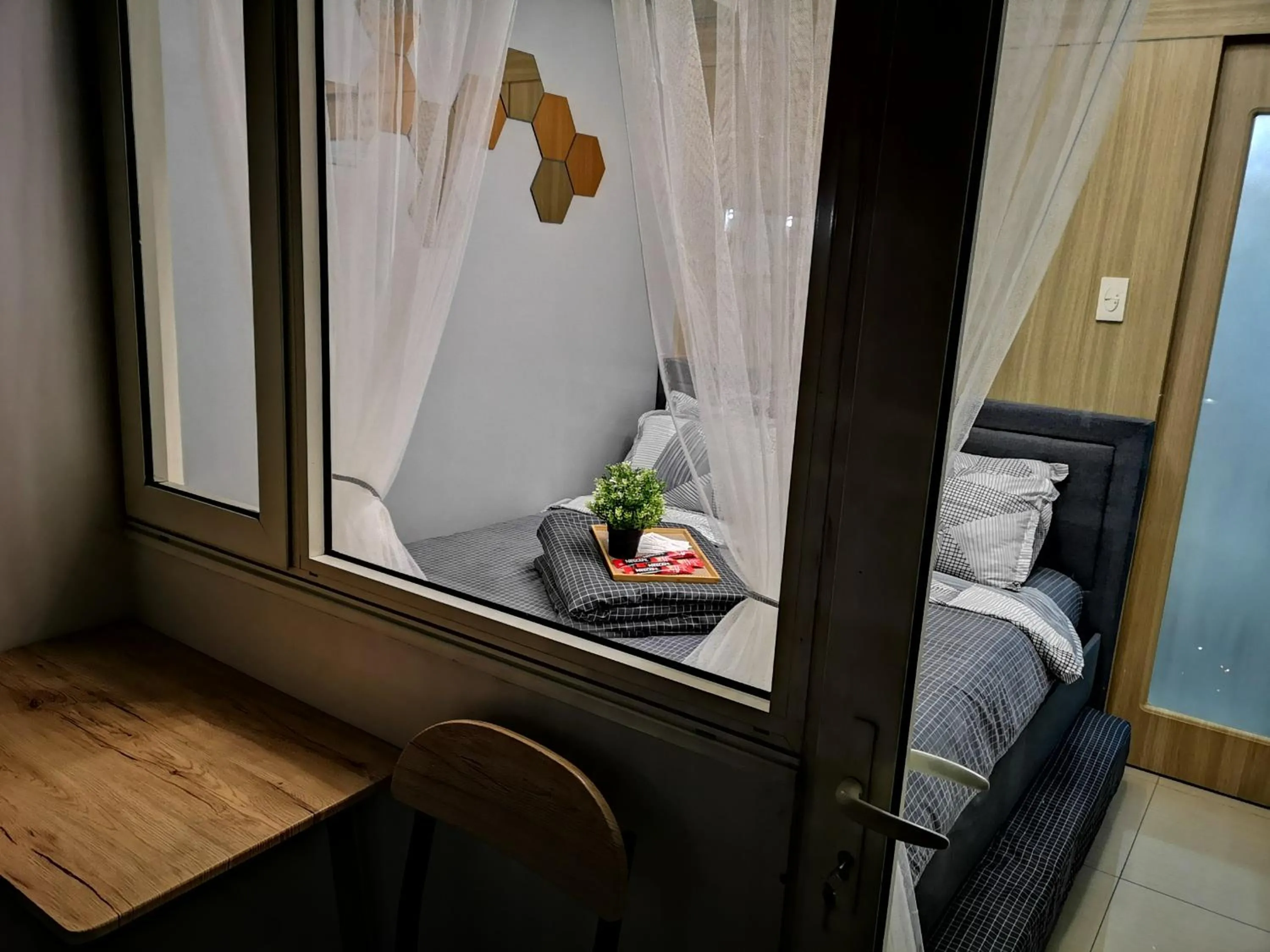 Balcony/Terrace, Bed in Shore Residences Mall of Asia Pool View 200mbps Free Wi-Fi