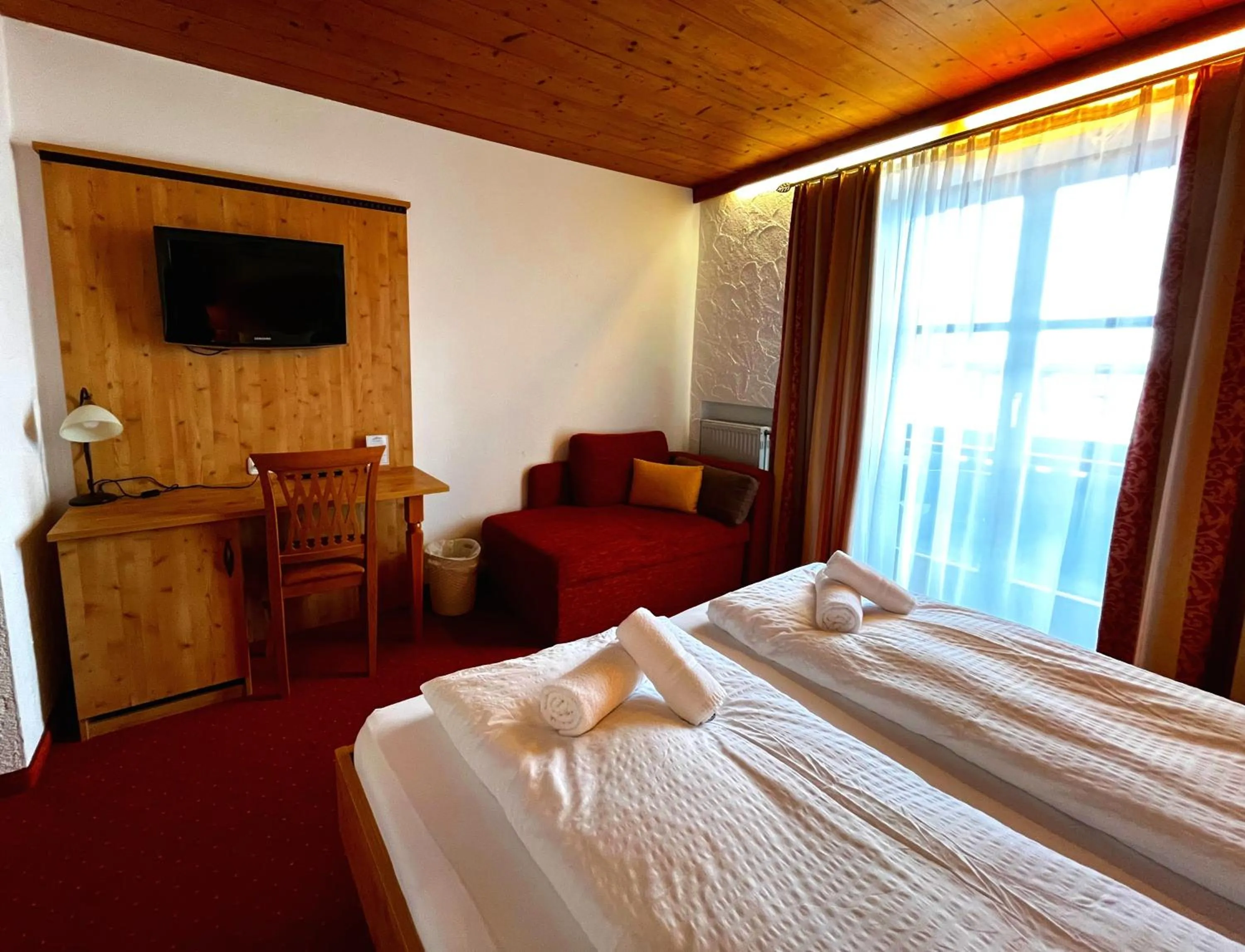 Bed in Das Maximilian - Feines Landhotel am Schliersee