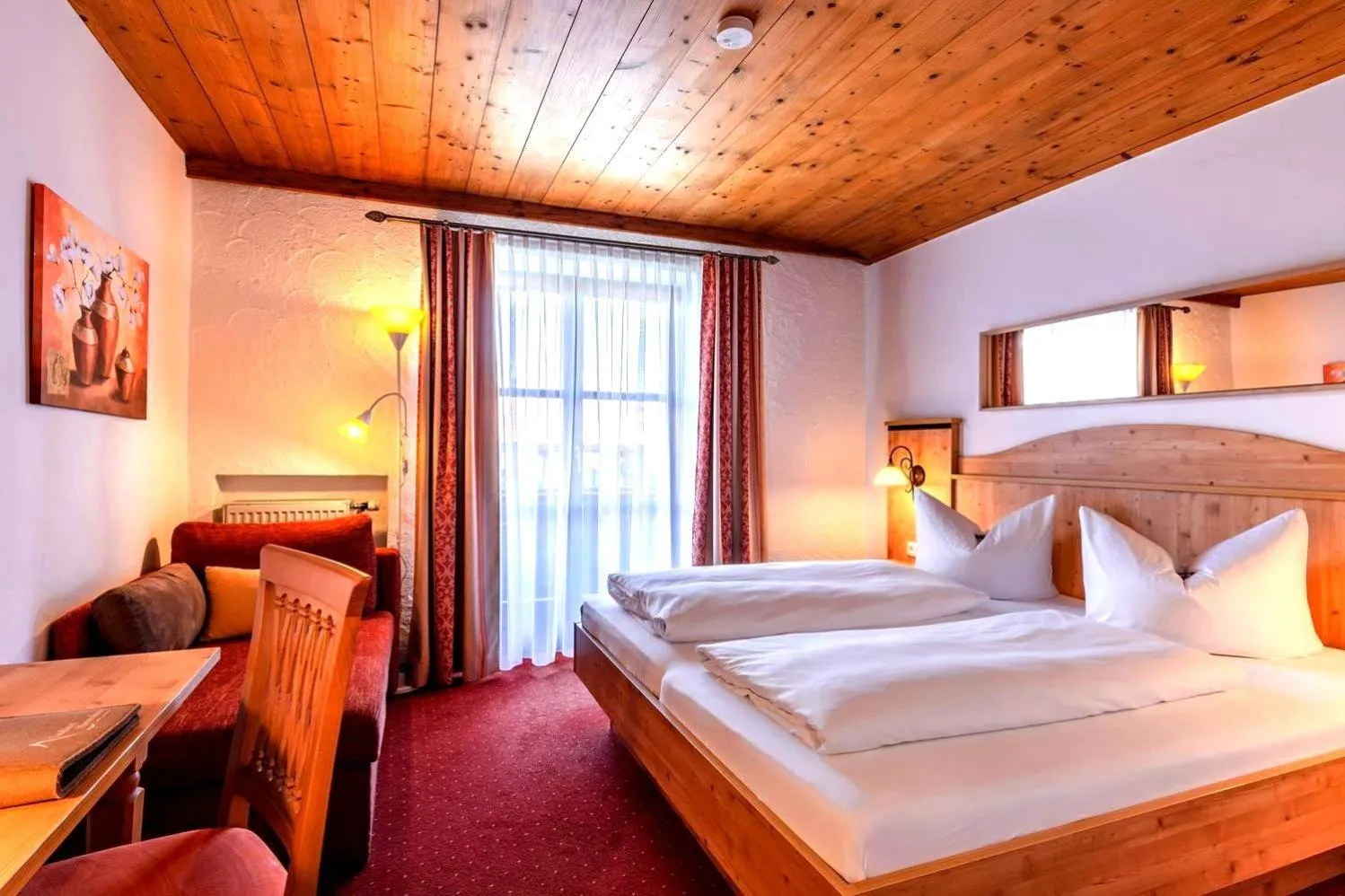 Bed in Das Maximilian - Feines Landhotel am Schliersee