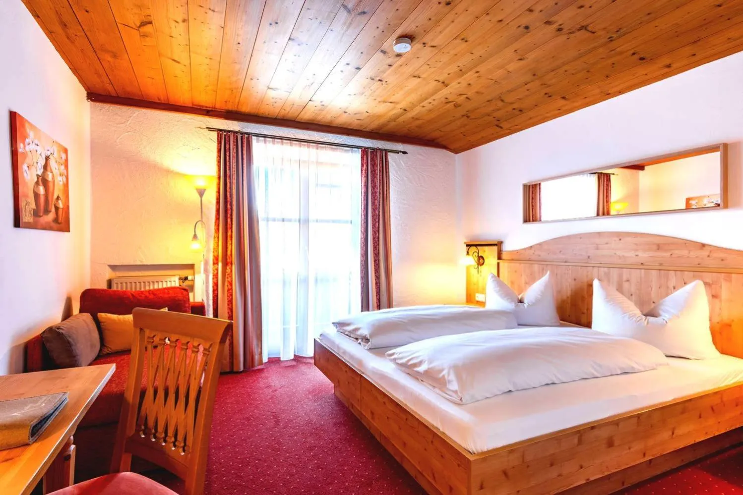 Bed in Das Maximilian - Feines Landhotel am Schliersee