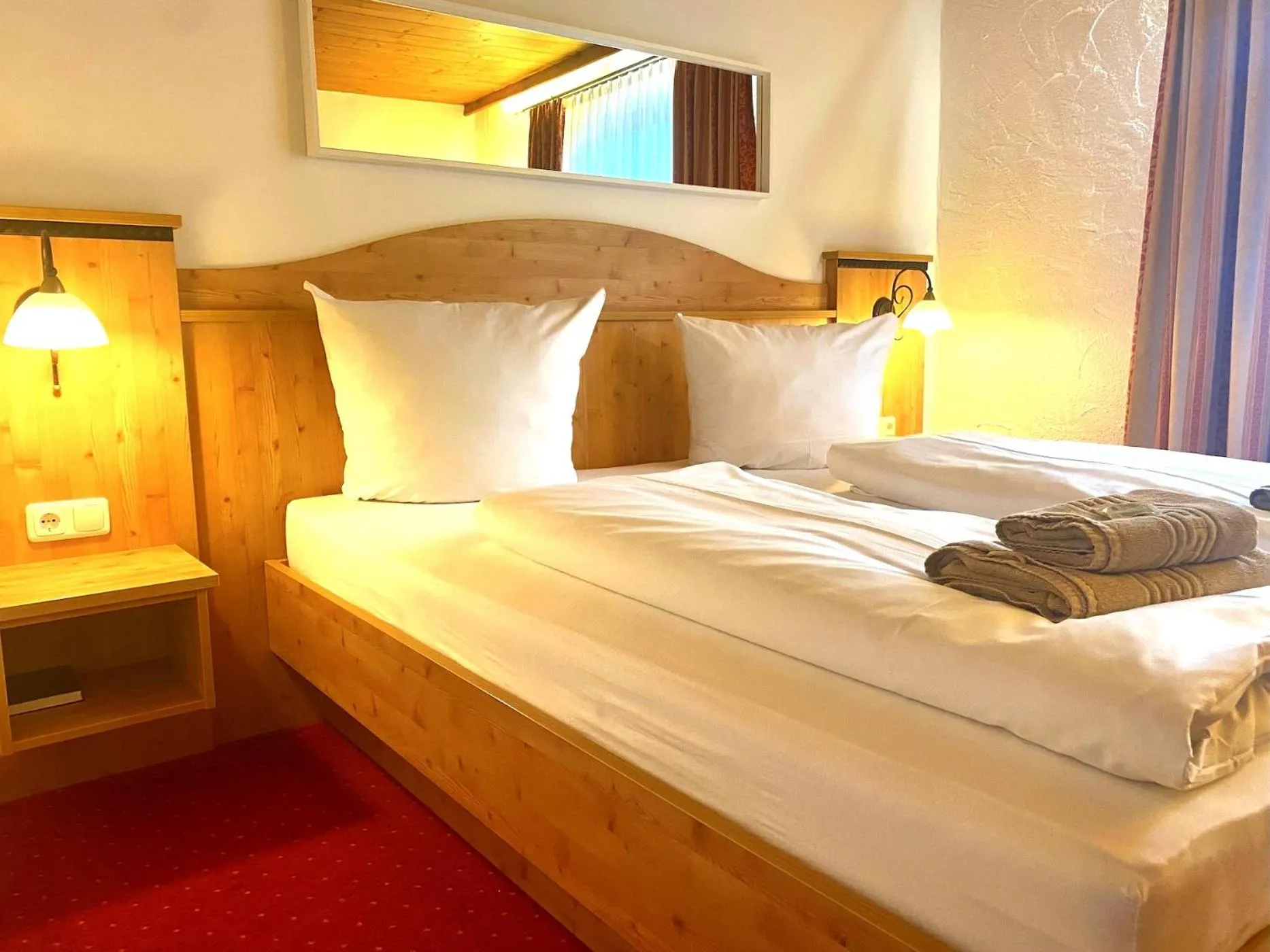 Bed in Das Maximilian - Feines Landhotel am Schliersee