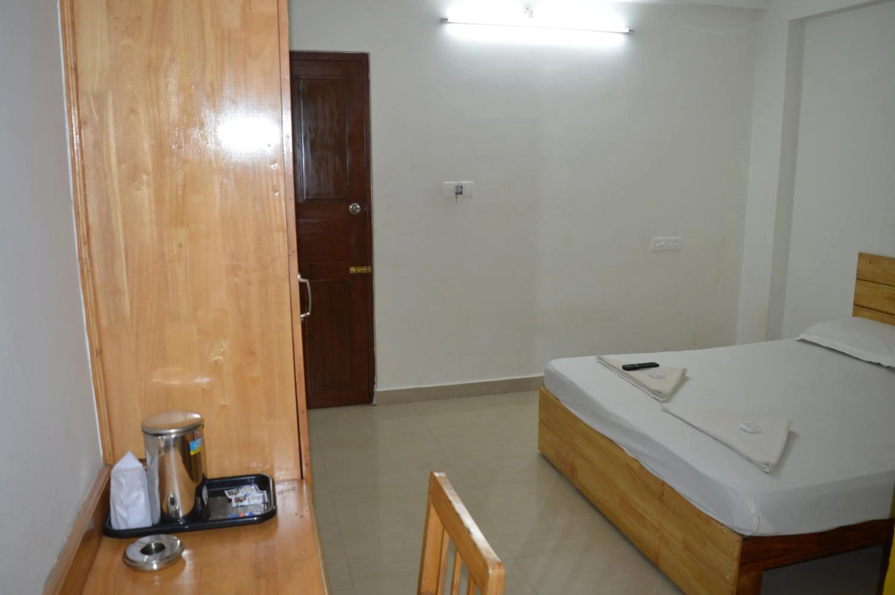 Seating area, Bed in A V Residency