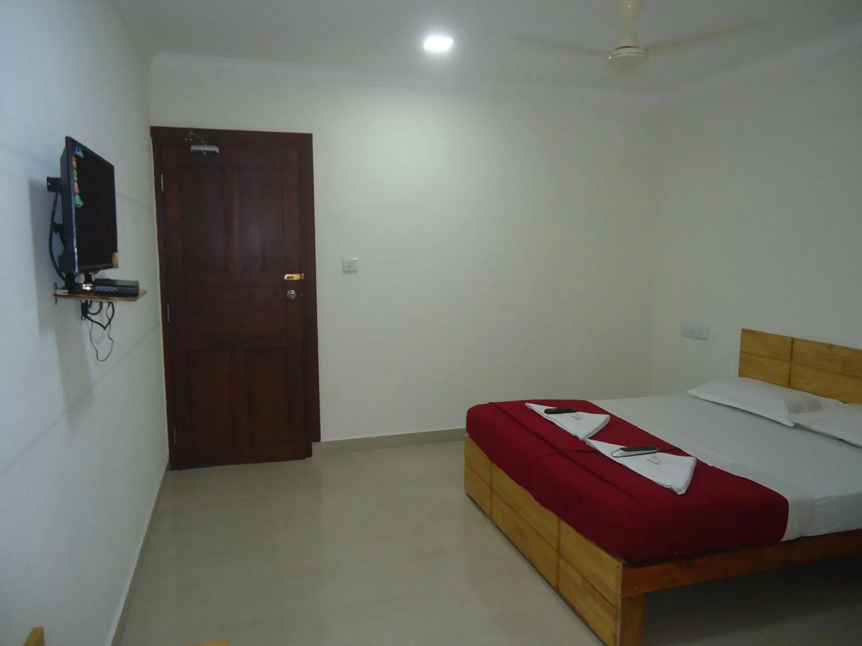 Photo of the whole room, Bed in A V Residency