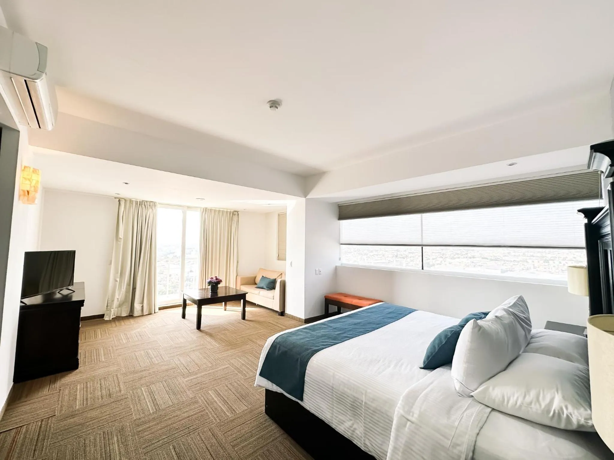 Living room, Bed in Hotel Stadium Leon