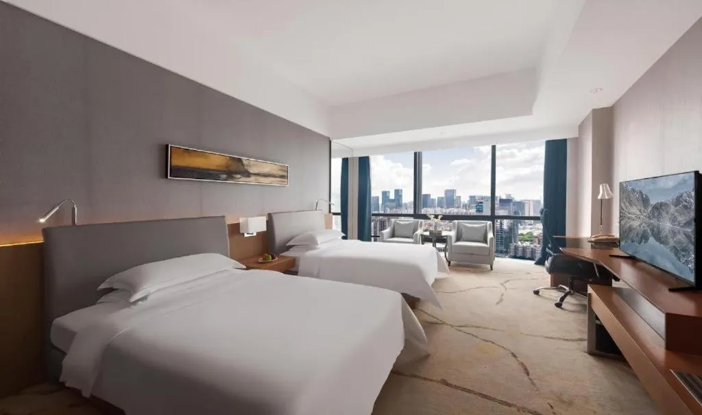 Bed in Huaqiang Plaza Hotel Shenzhen, Enjoy Complimentary Mini Bar & Night Snack, Add breakfast - enjoy complimentary afternoon tea