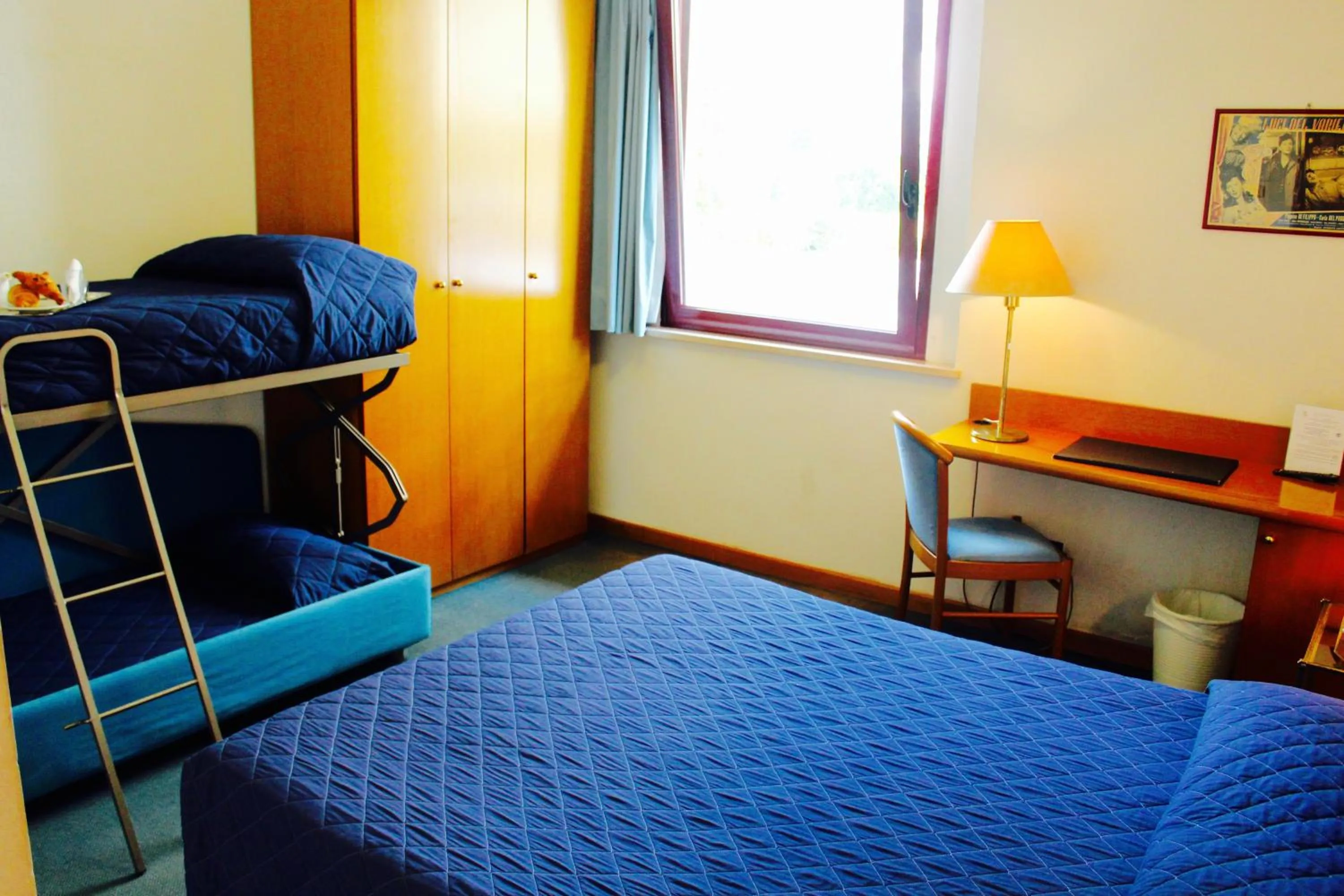 Bed in Arcangelo Roof Hotel