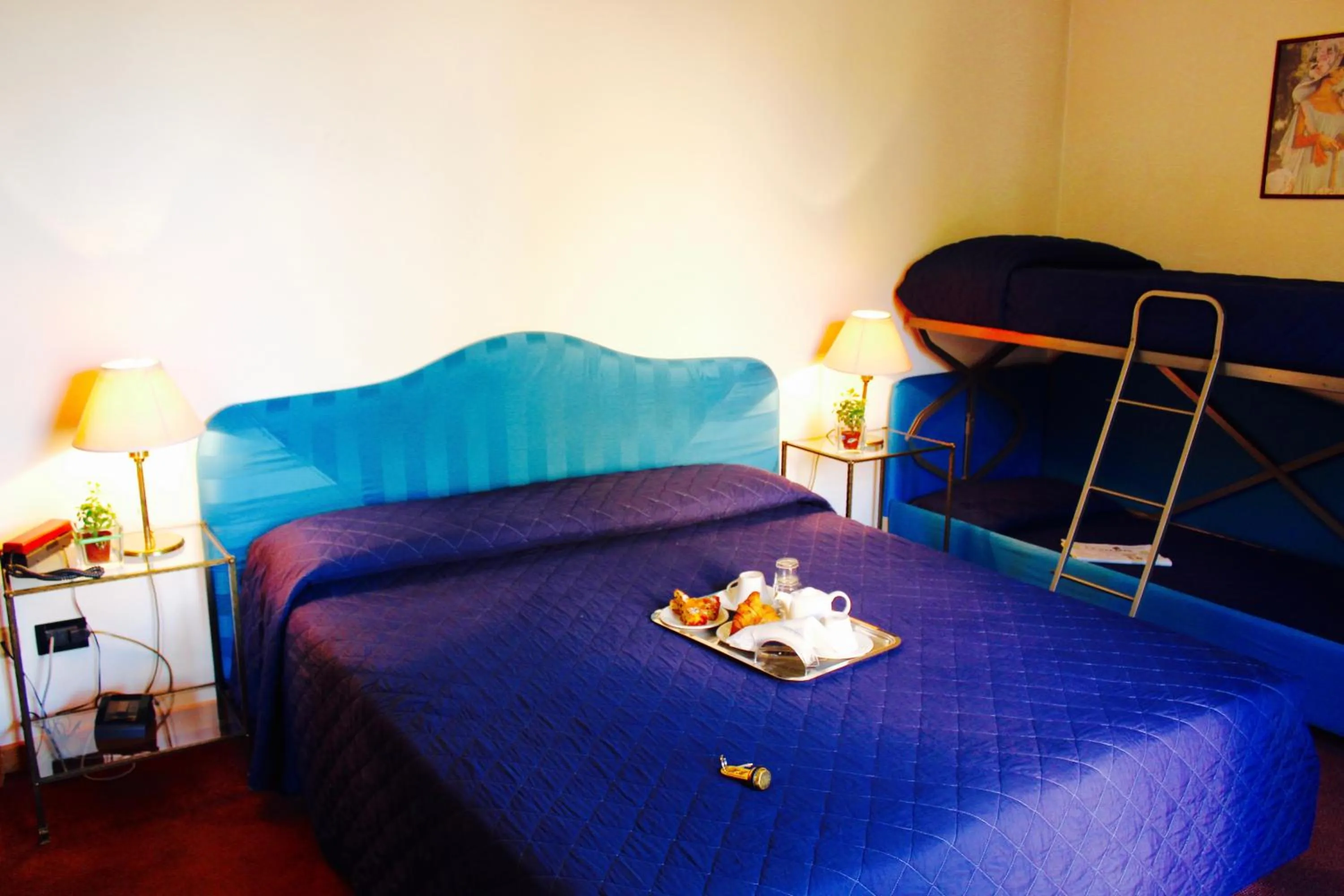 Bed in Arcangelo Roof Hotel