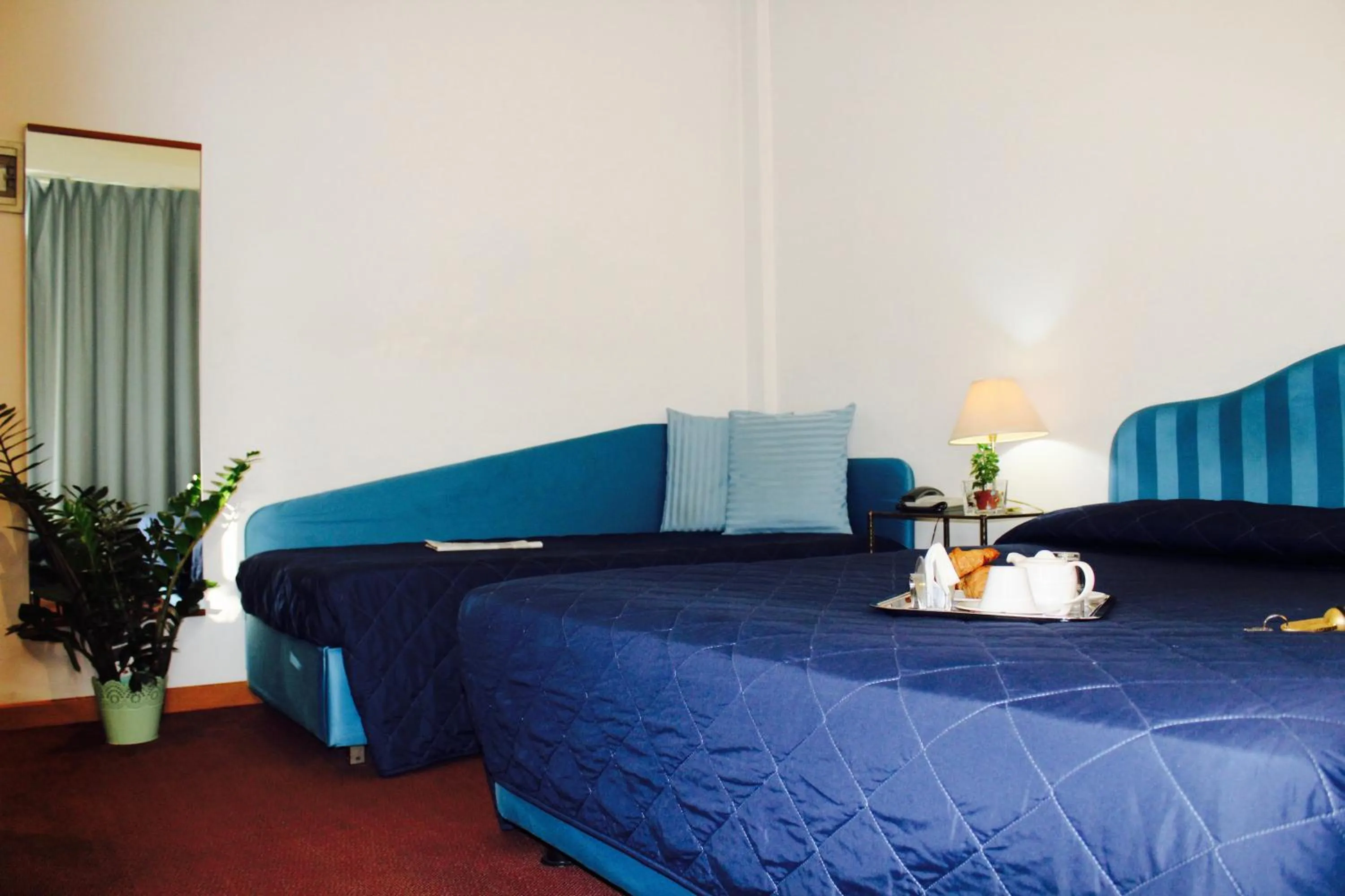 Bed in Arcangelo Roof Hotel