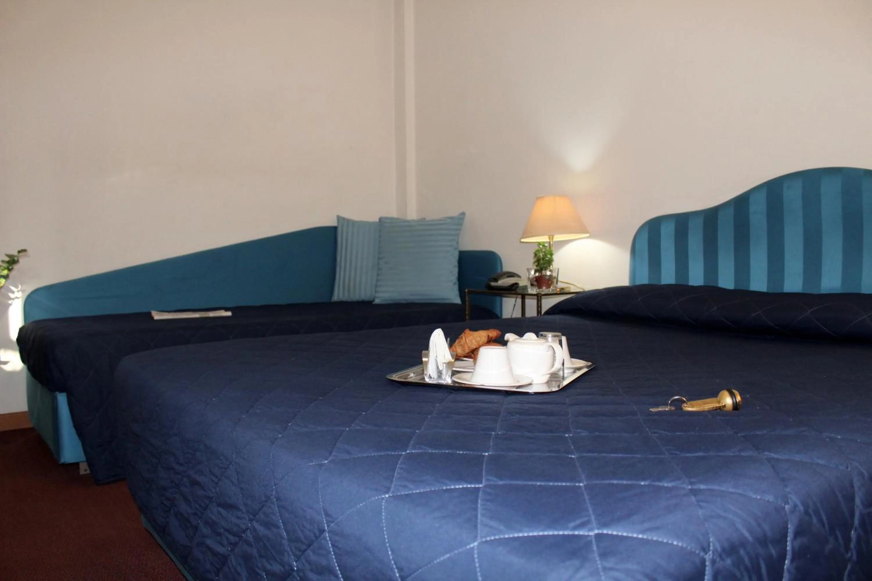 Bed in Arcangelo Roof Hotel