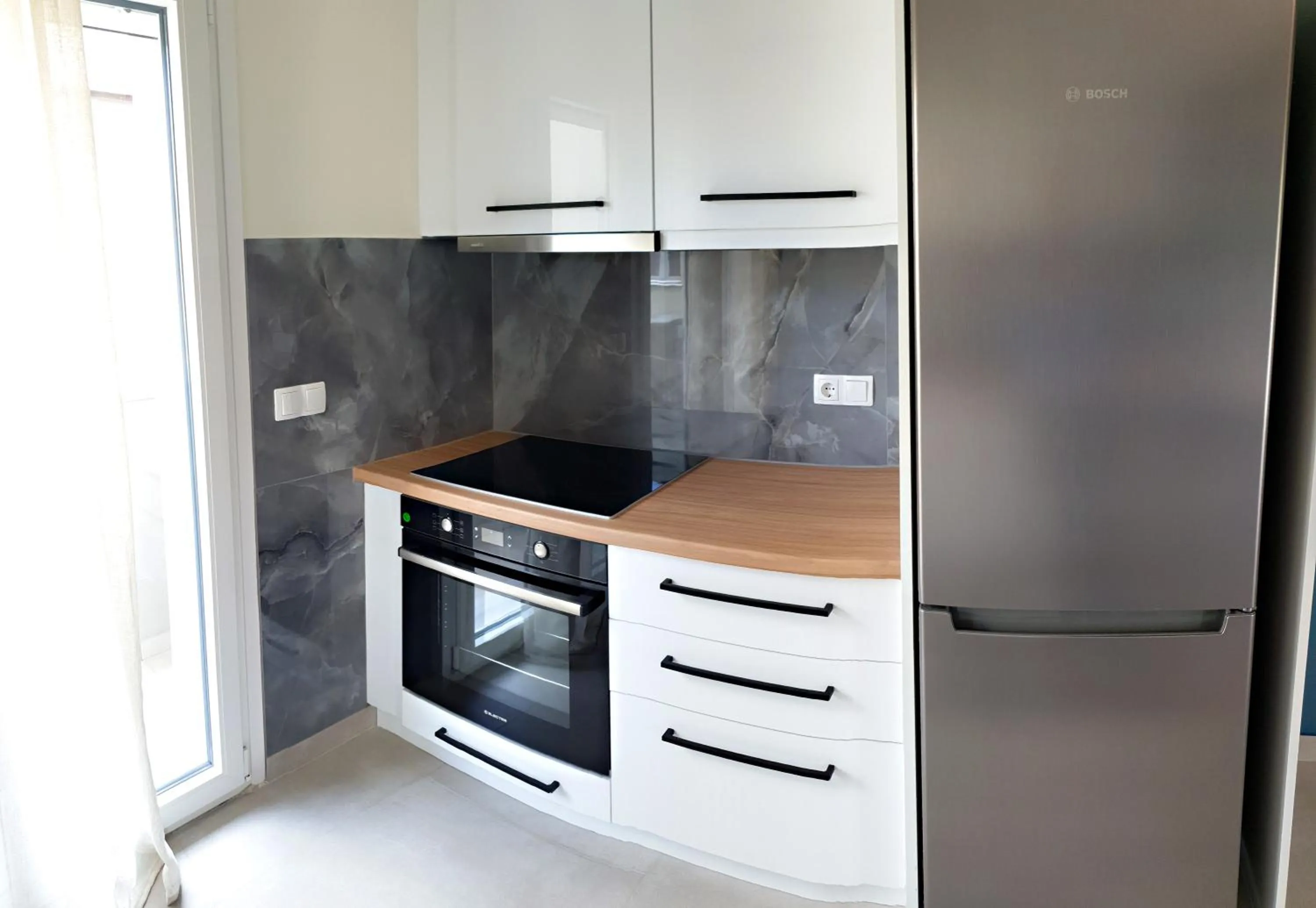 kitchen in Almeta Suites