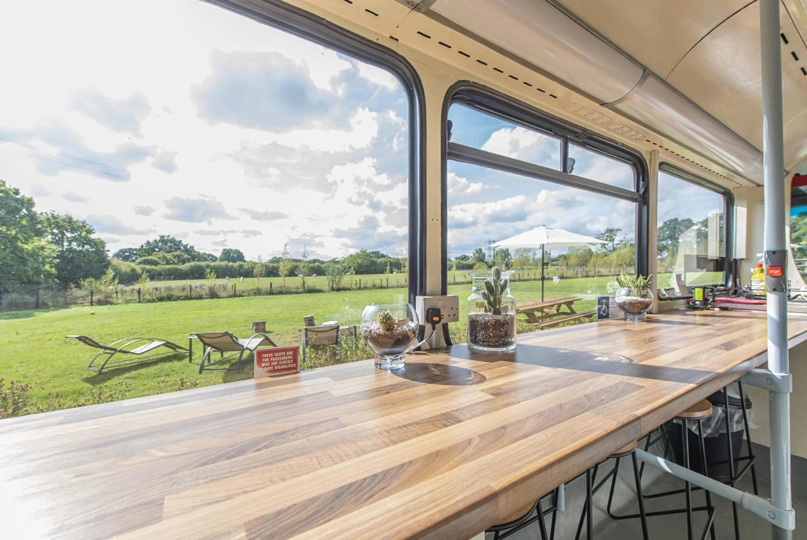 Dining area in Double Decker Bus on an Alpaca Farm sleeps 8