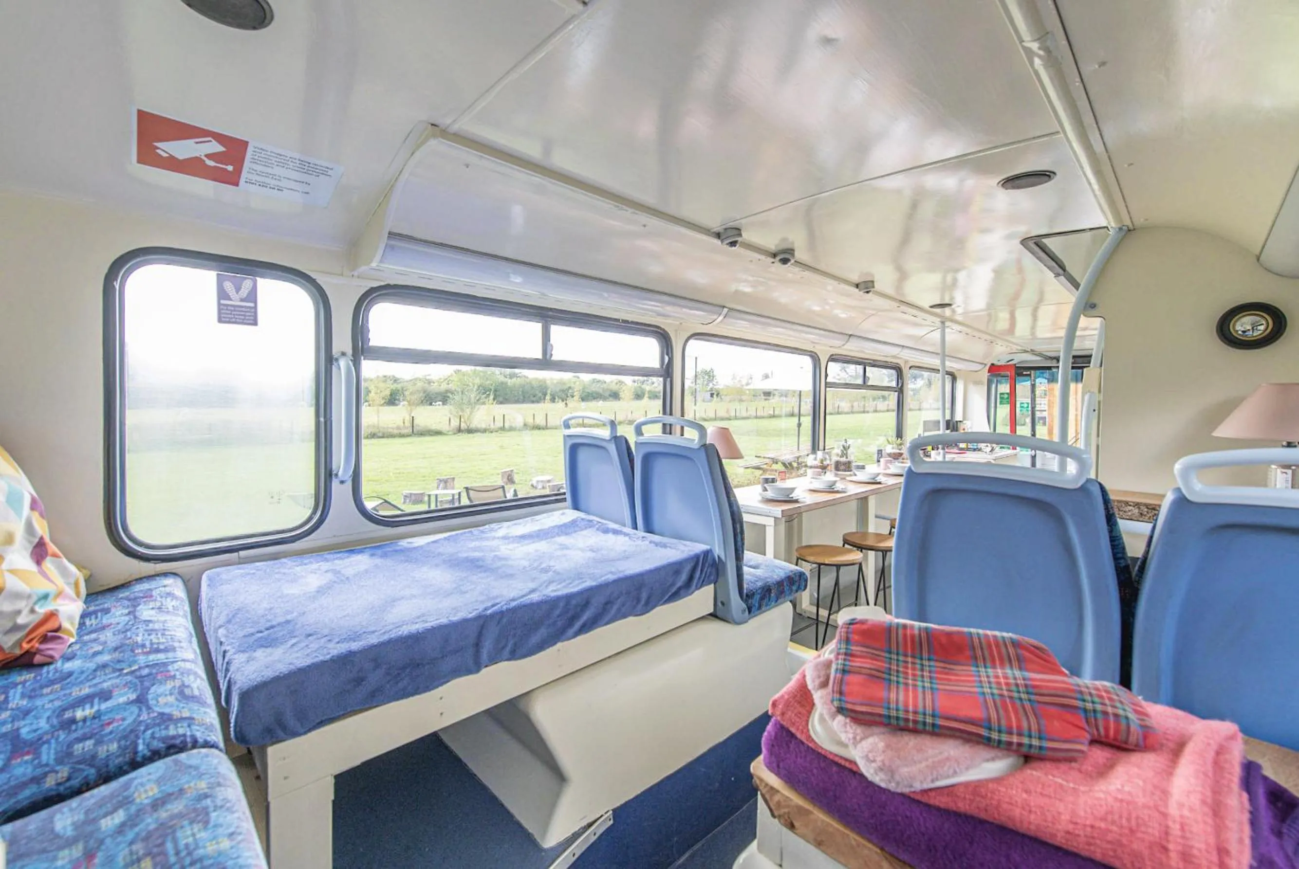 Living room in Double Decker Bus on an Alpaca Farm sleeps 8