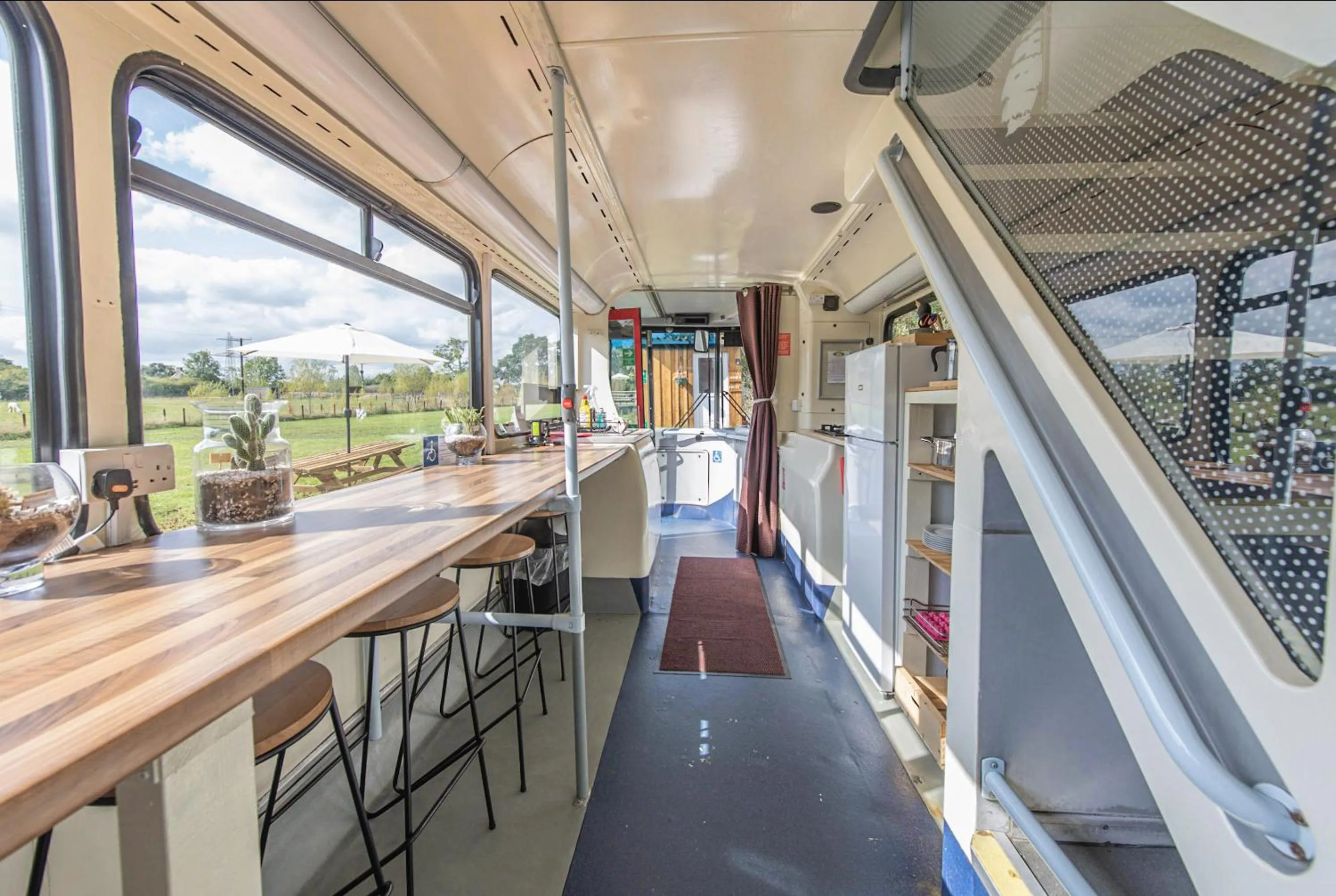 Dining area in Double Decker Bus on an Alpaca Farm sleeps 8