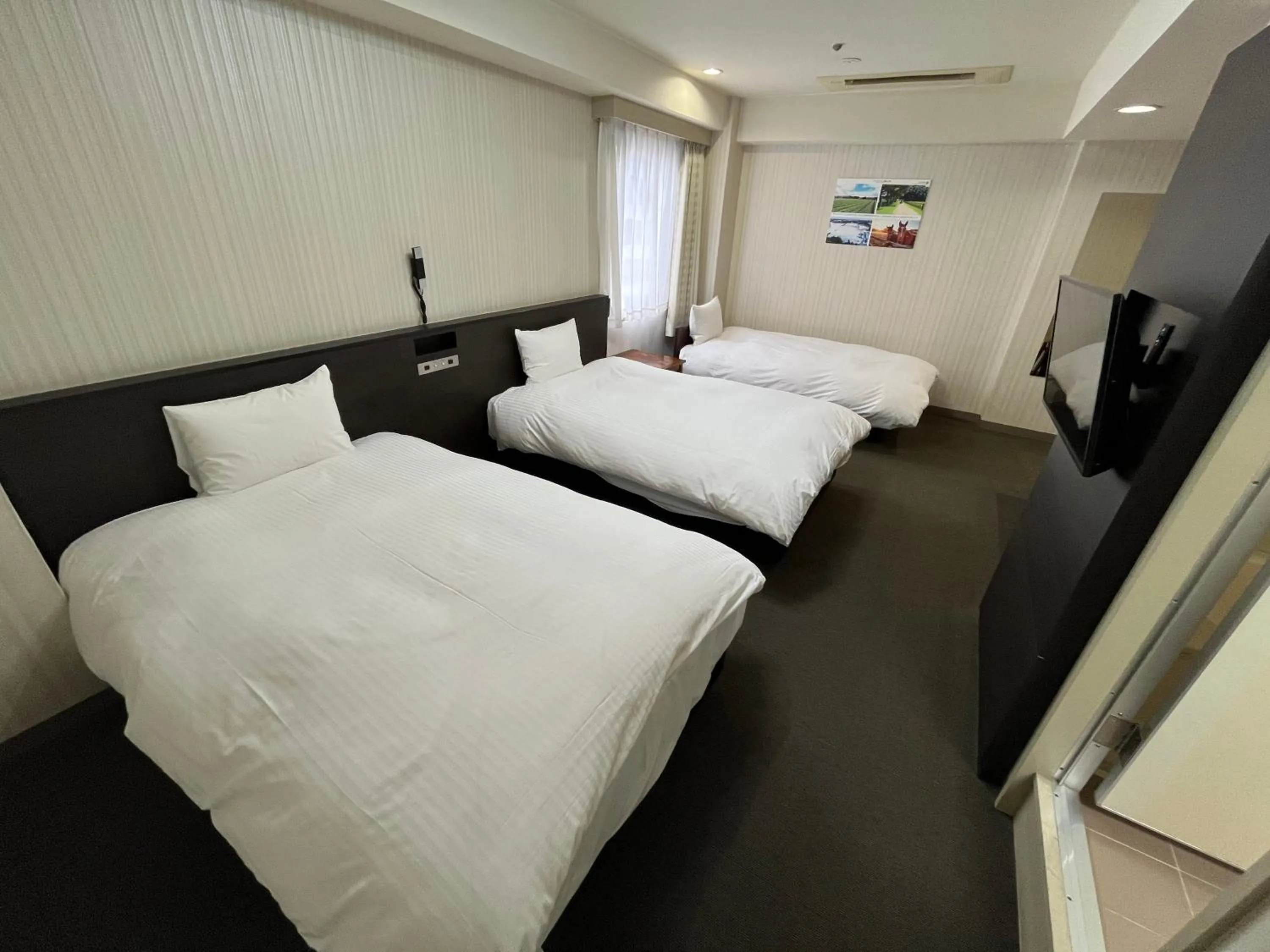 Bed in Hotel Continental Fuchu