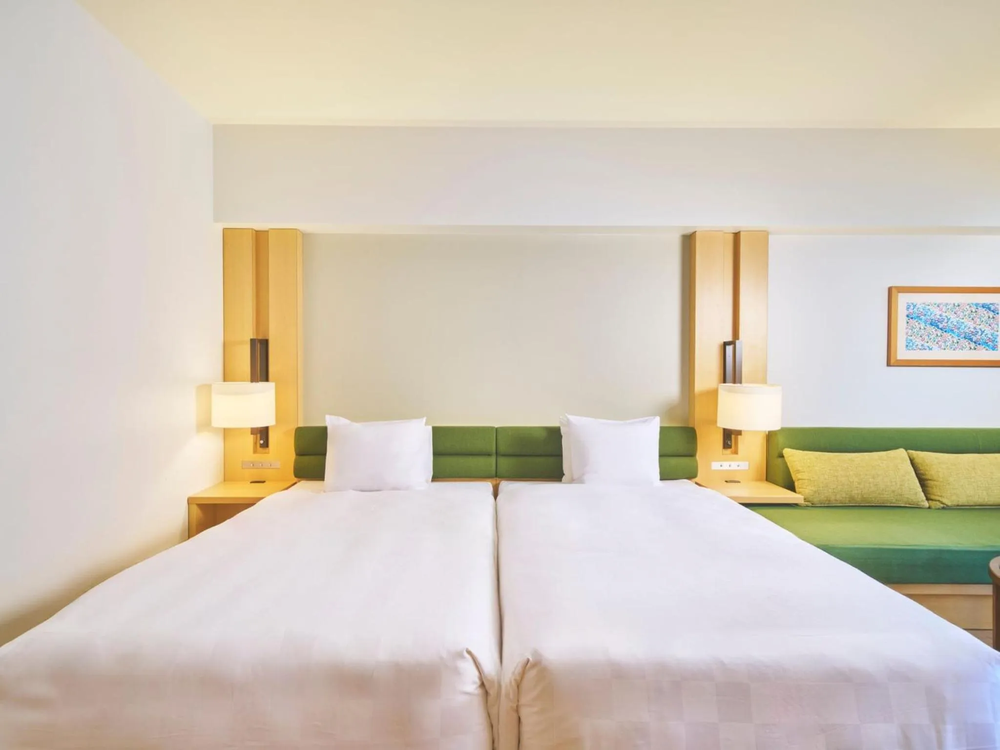 Bed in The Orion Hotel Motobu Resort & Spa