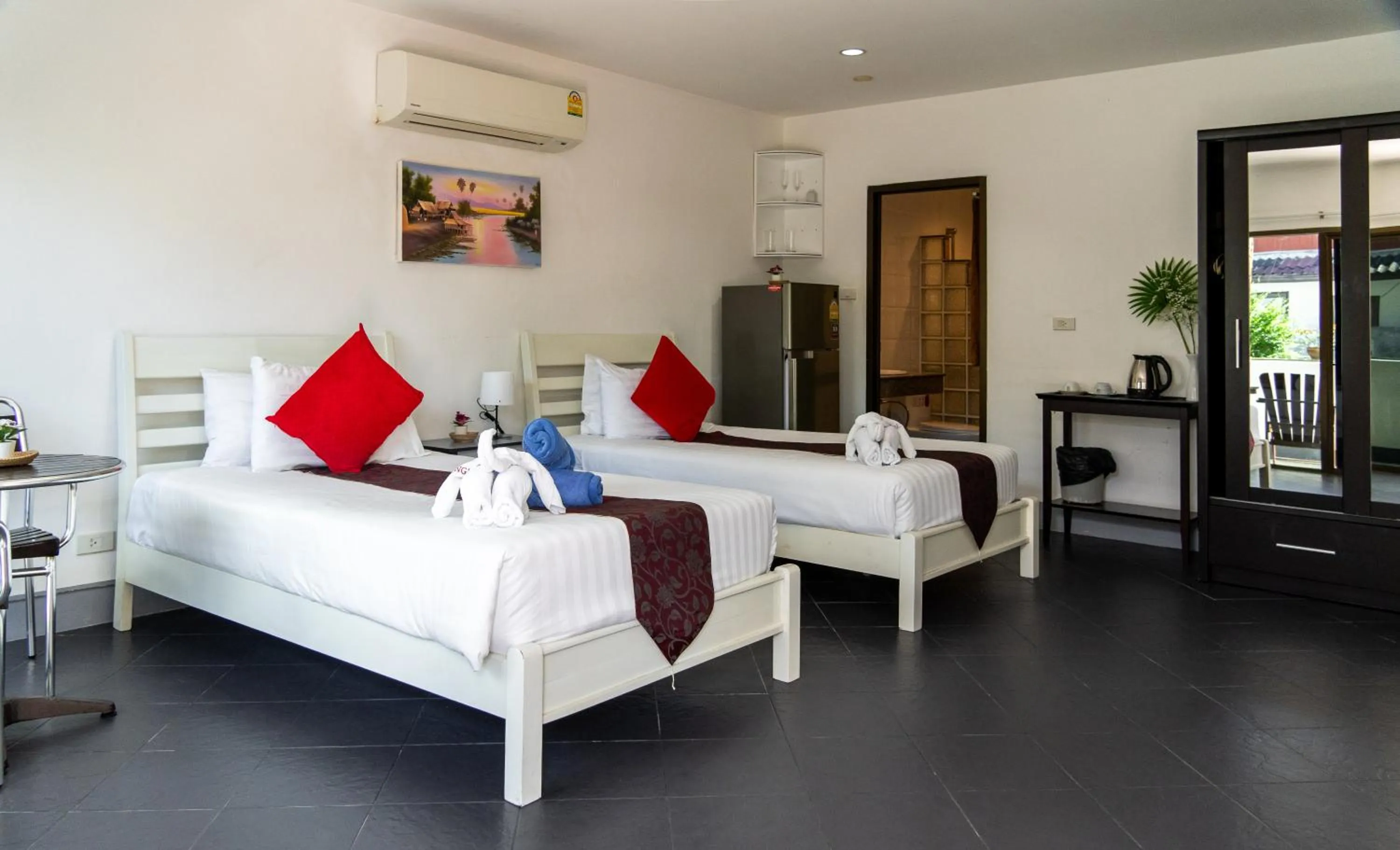 Bed in Deng's kamala beach Guesthouse