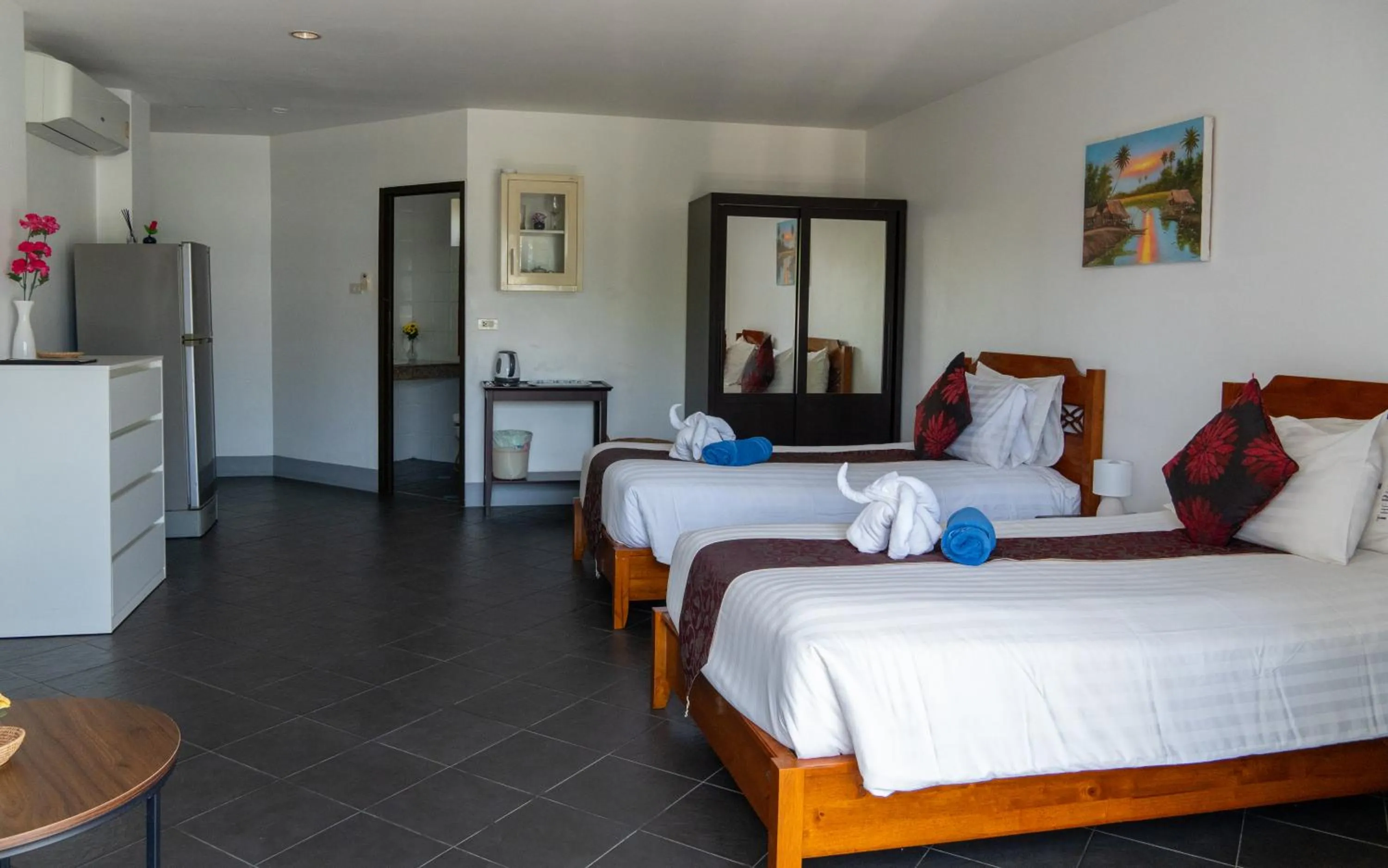 Bed in Deng's kamala beach Guesthouse