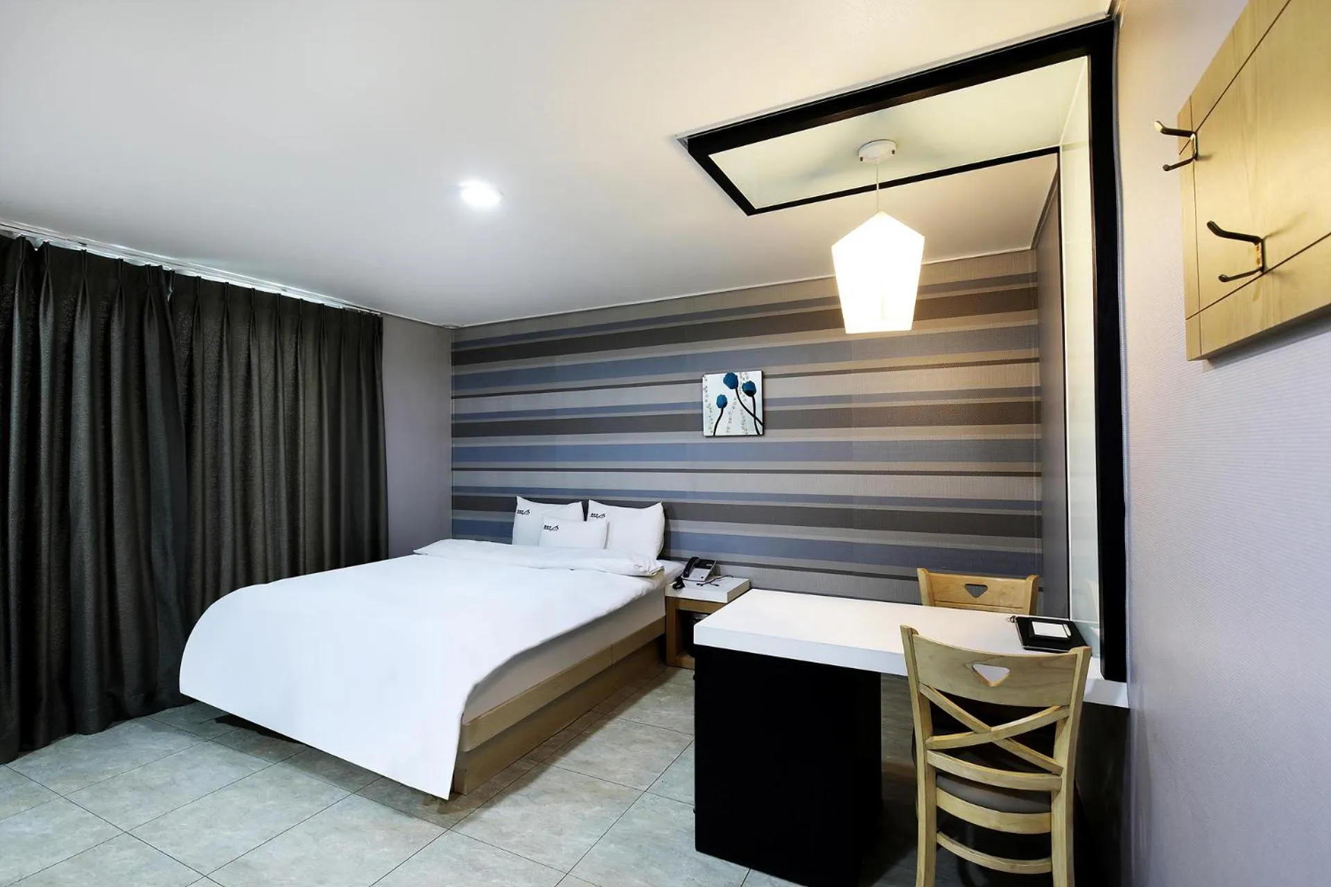 Bed in White Tourist Hotel