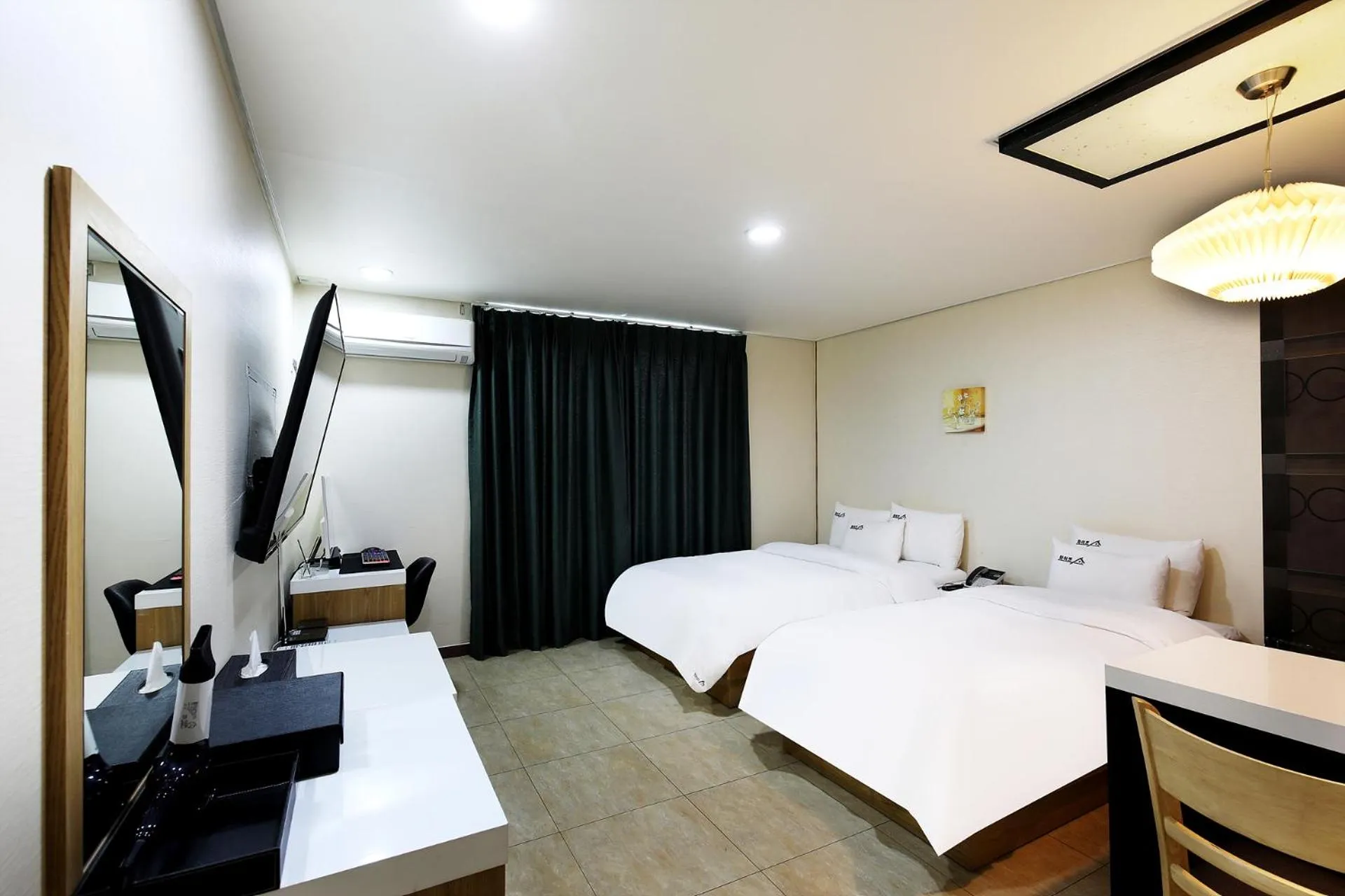 Bed in White Tourist Hotel