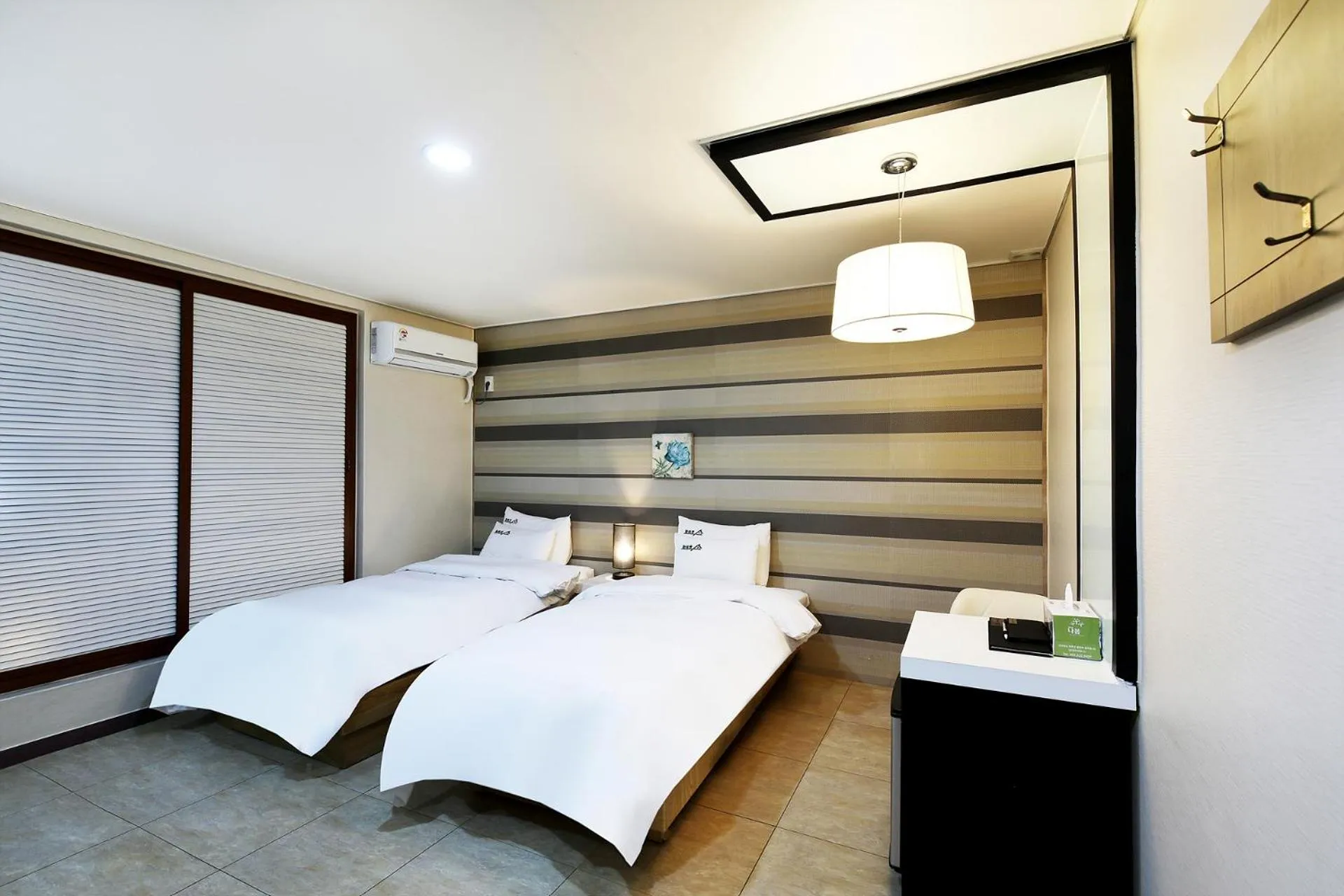 Bed in White Tourist Hotel