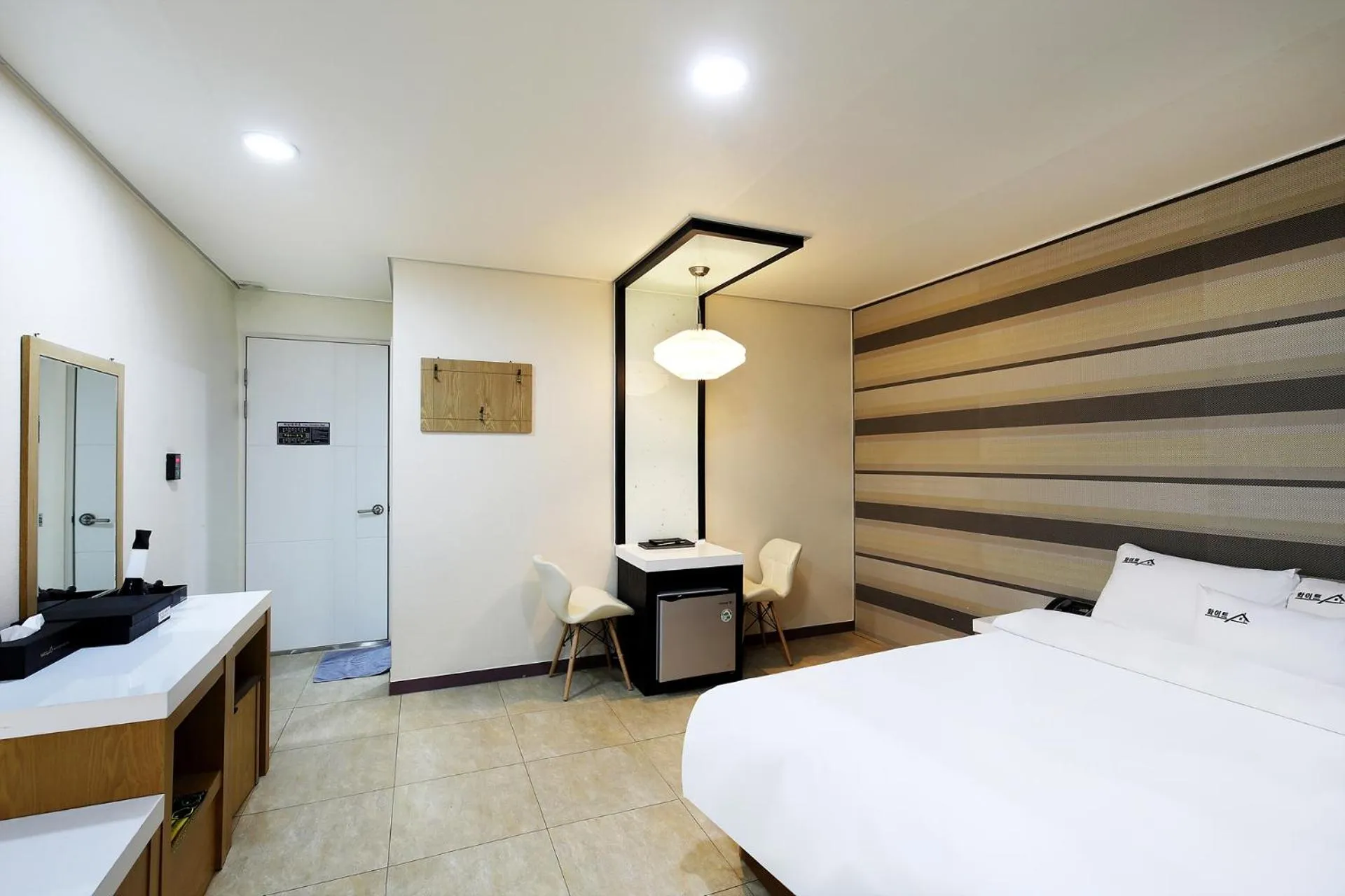 Bed in White Tourist Hotel