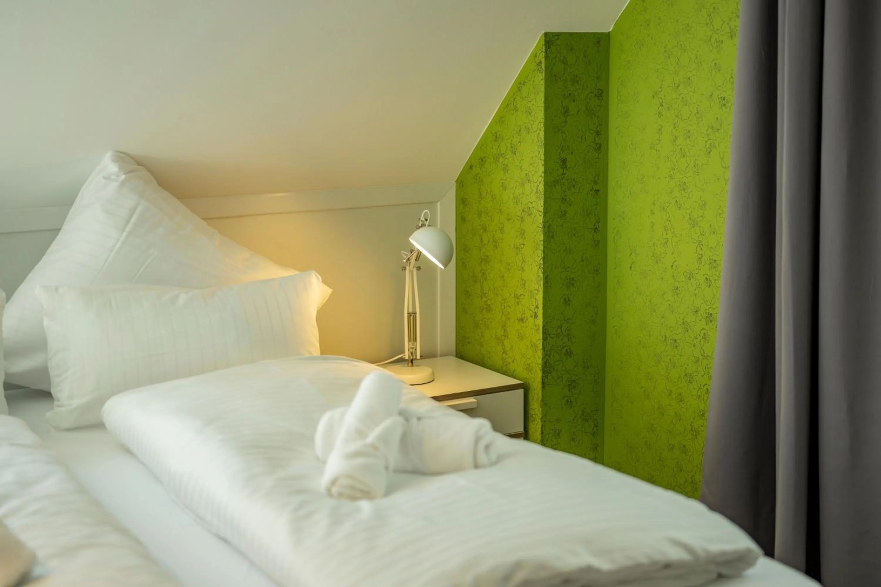 Bed in Gästehaus am Schlossplatz, Z. 4