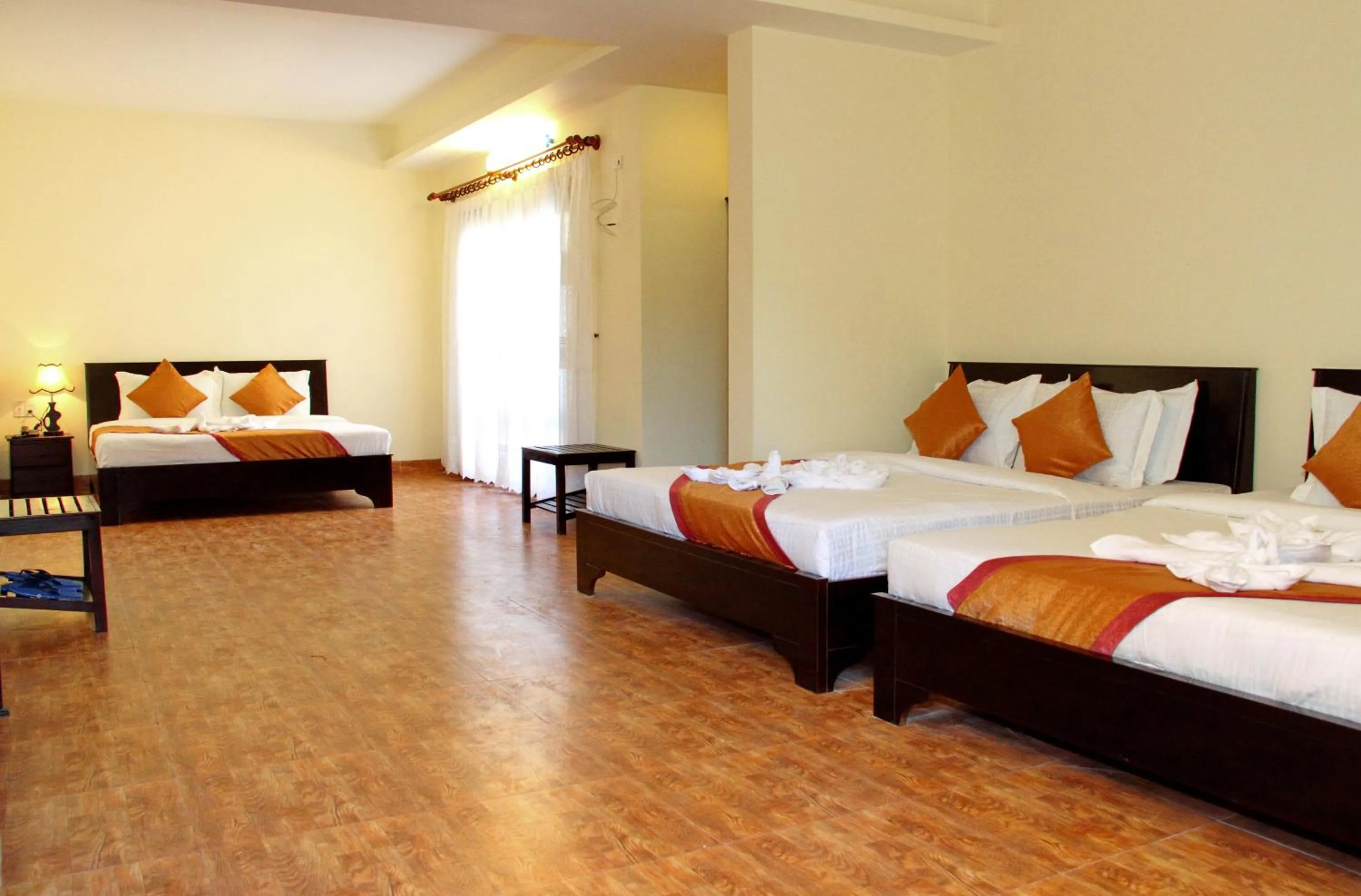 Bed in Sun & Sands Beach Hotel