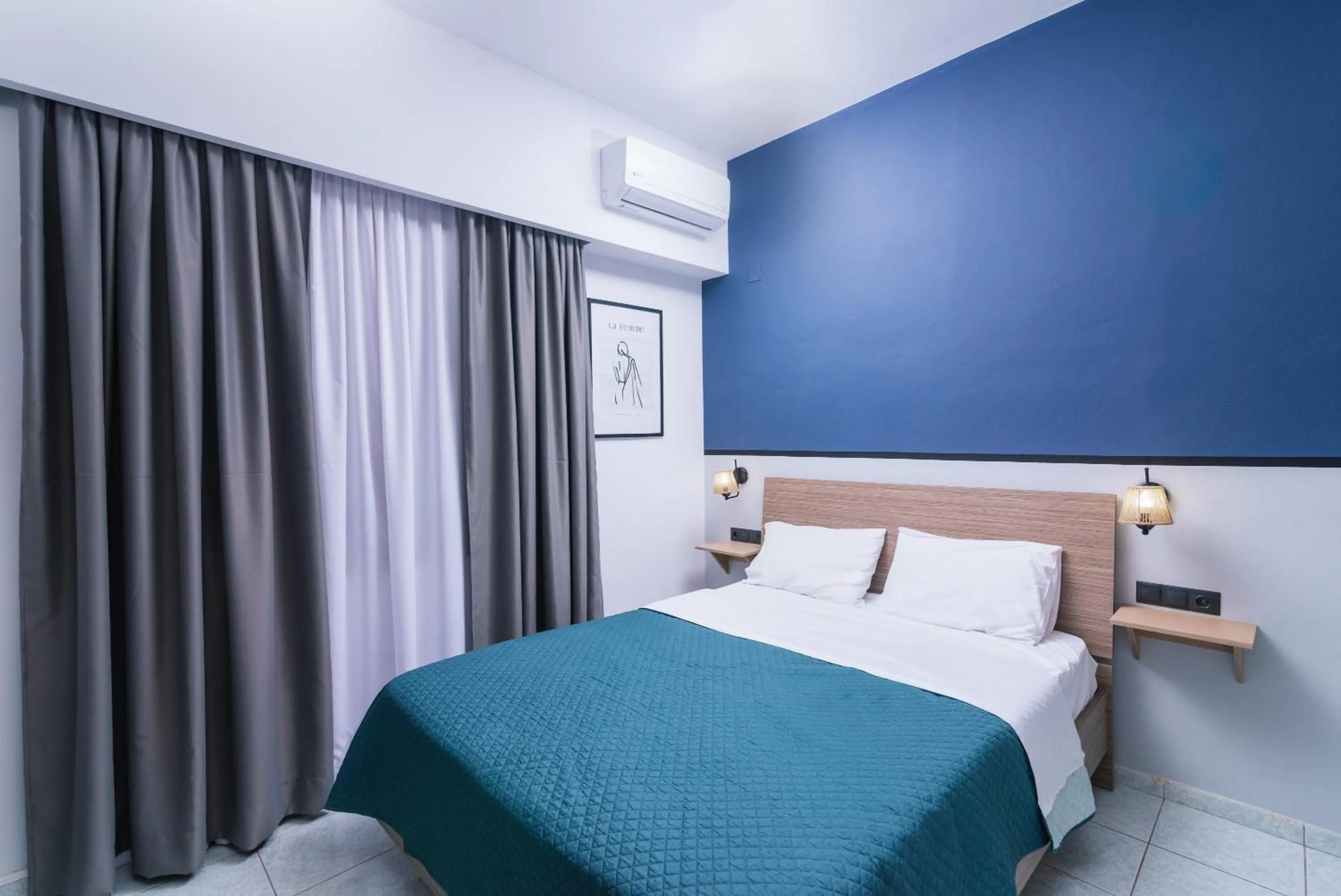 Bed in Alcyone Studios and Apartments