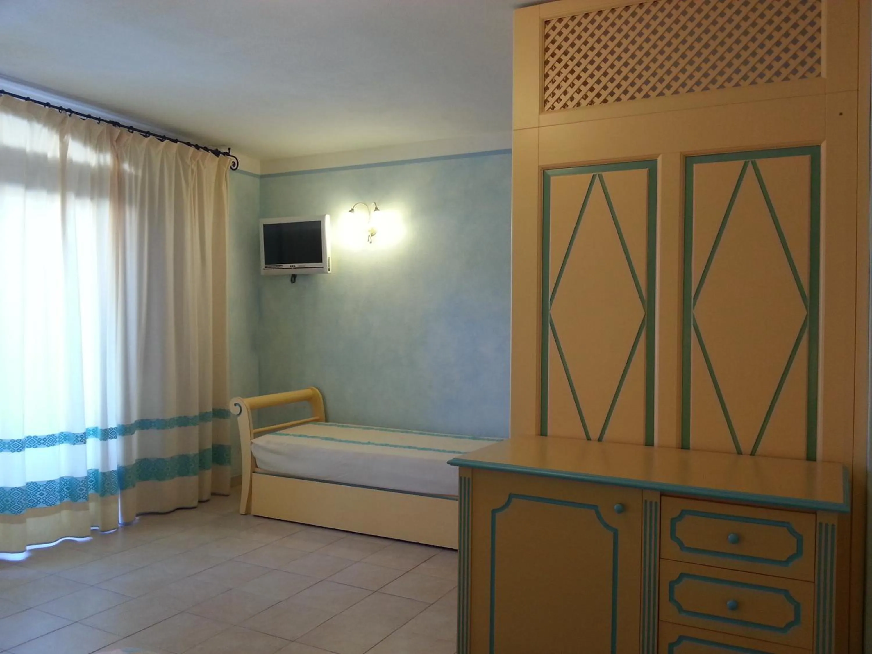Bedroom in Residence Riva Azzurra