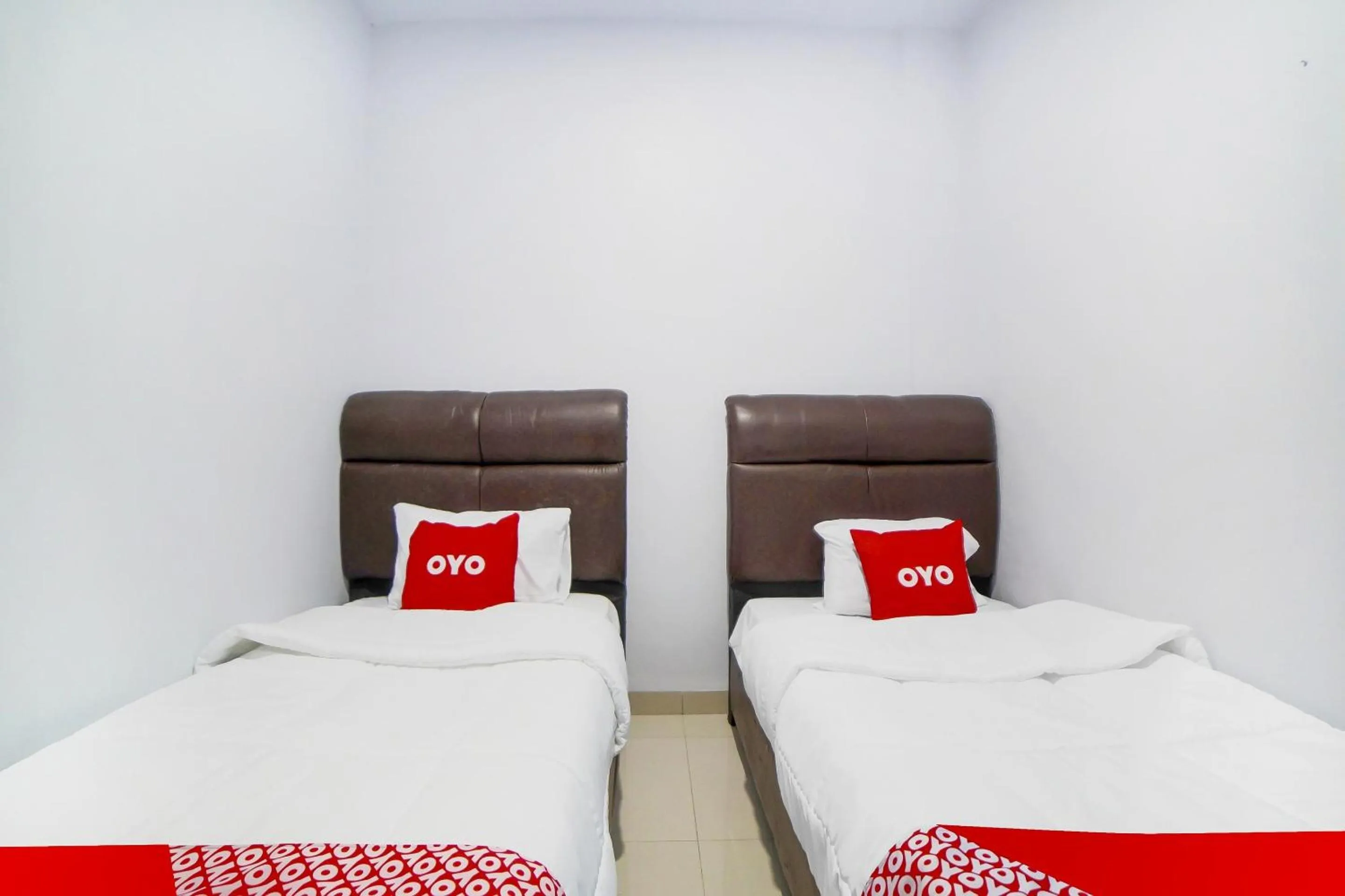 Bedroom in OYO 91283 Sg Premium Guest House