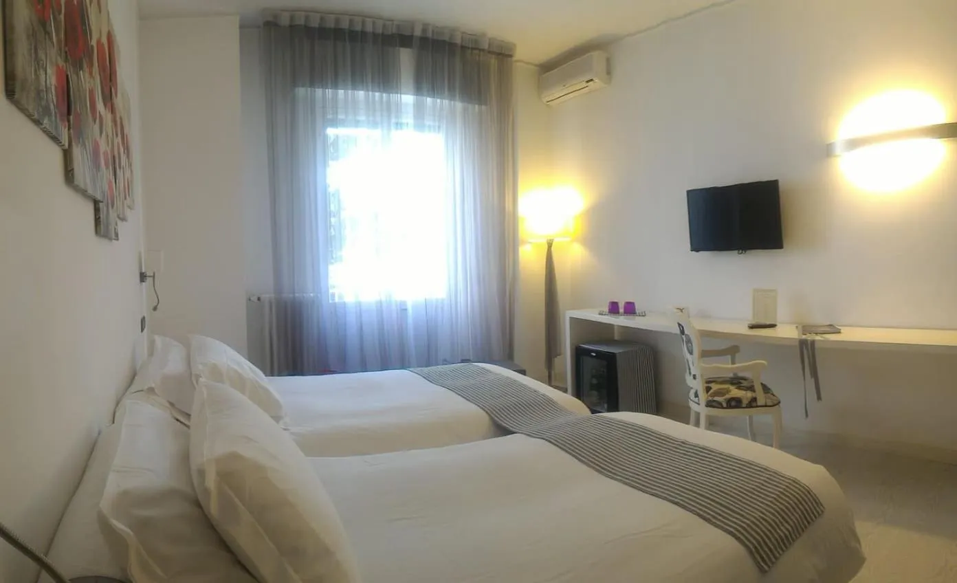 Photo of the whole room, Bed in Eveline Portosole Hotel